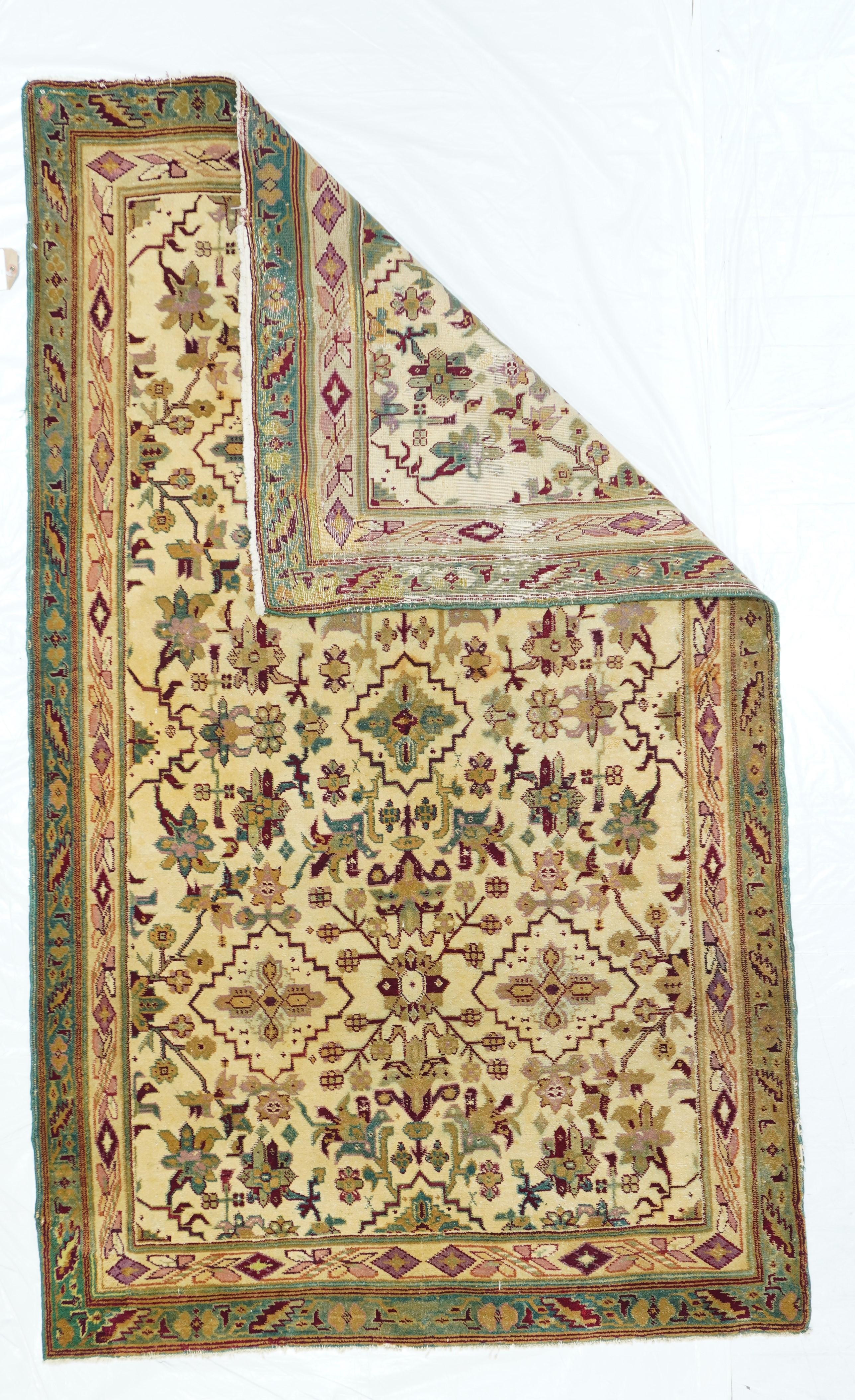 Antique Agra rug 4' x 6'9''. The northern city of Agra was once the capital of the Mughal Empire and has been weaving high quality rugs in all formats and sizes for a varied clientele, both within India and as an export item, for centuries. The