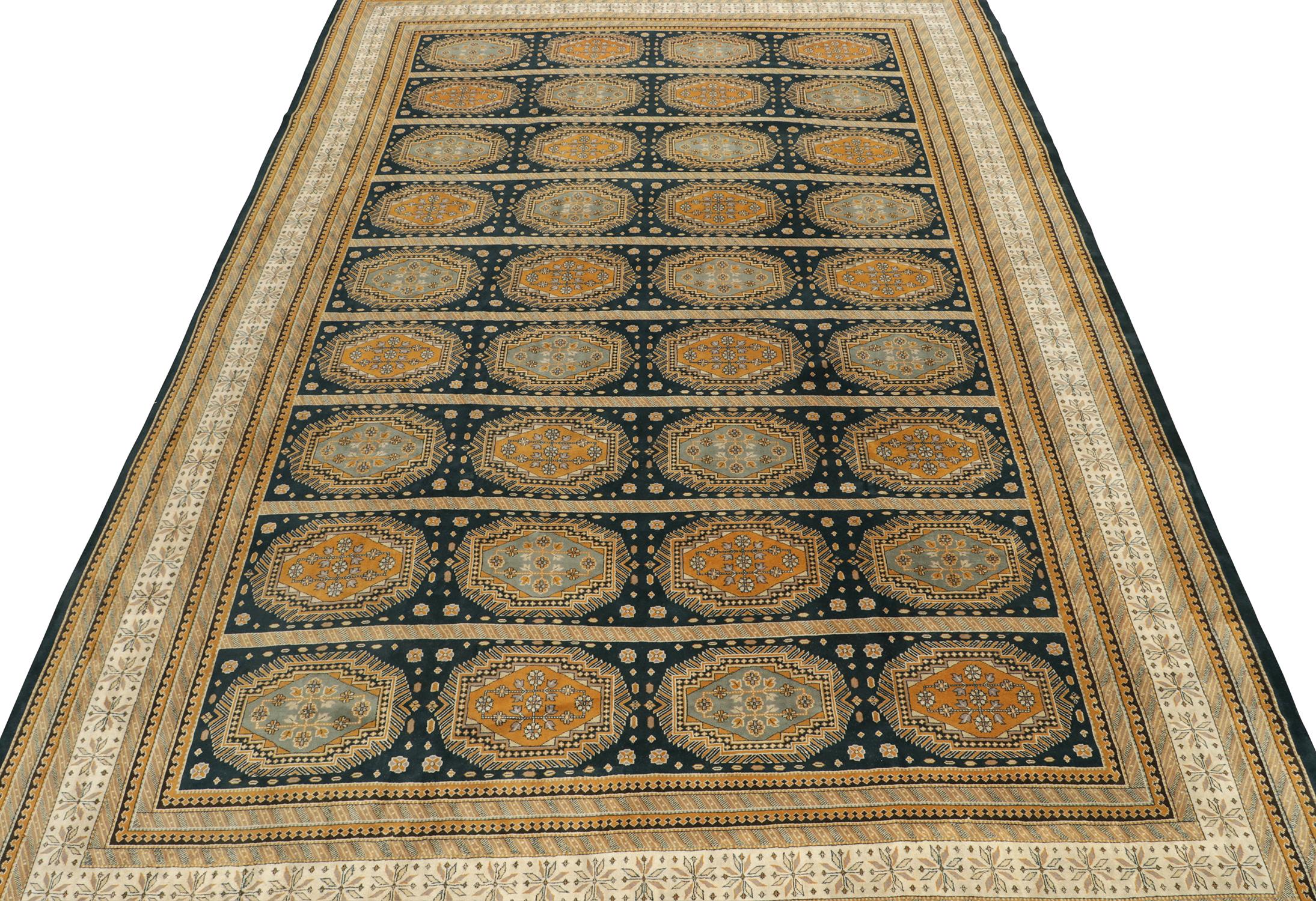 A rare antique 12x18 Agra rug in blue and gold, hand knotted in wool circa 1910-1920.

Further on the Design:

This particular Agra is a rare production in regal colors, meticulous details, and grand large size like few others. Likewise, such warm