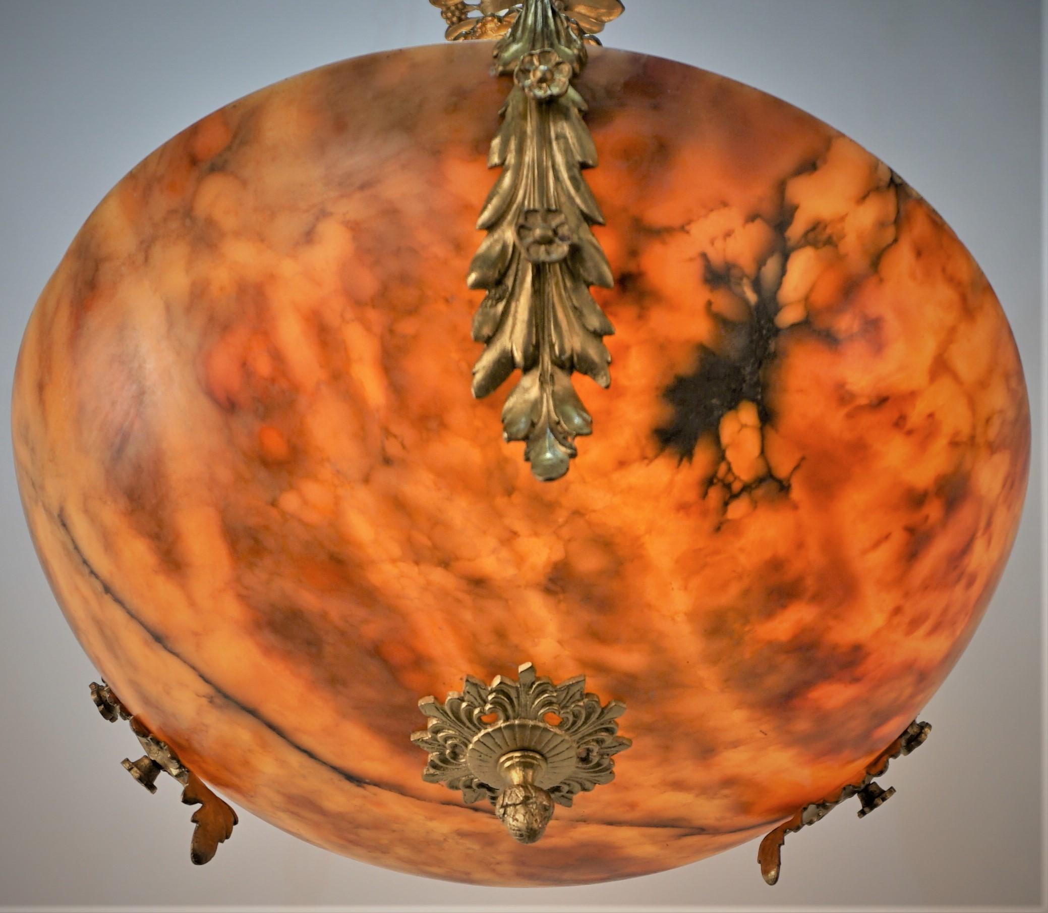 Beautiful amber-multi color alabaster chandelier with bronze hardware.
Six lights, 75watt max each.