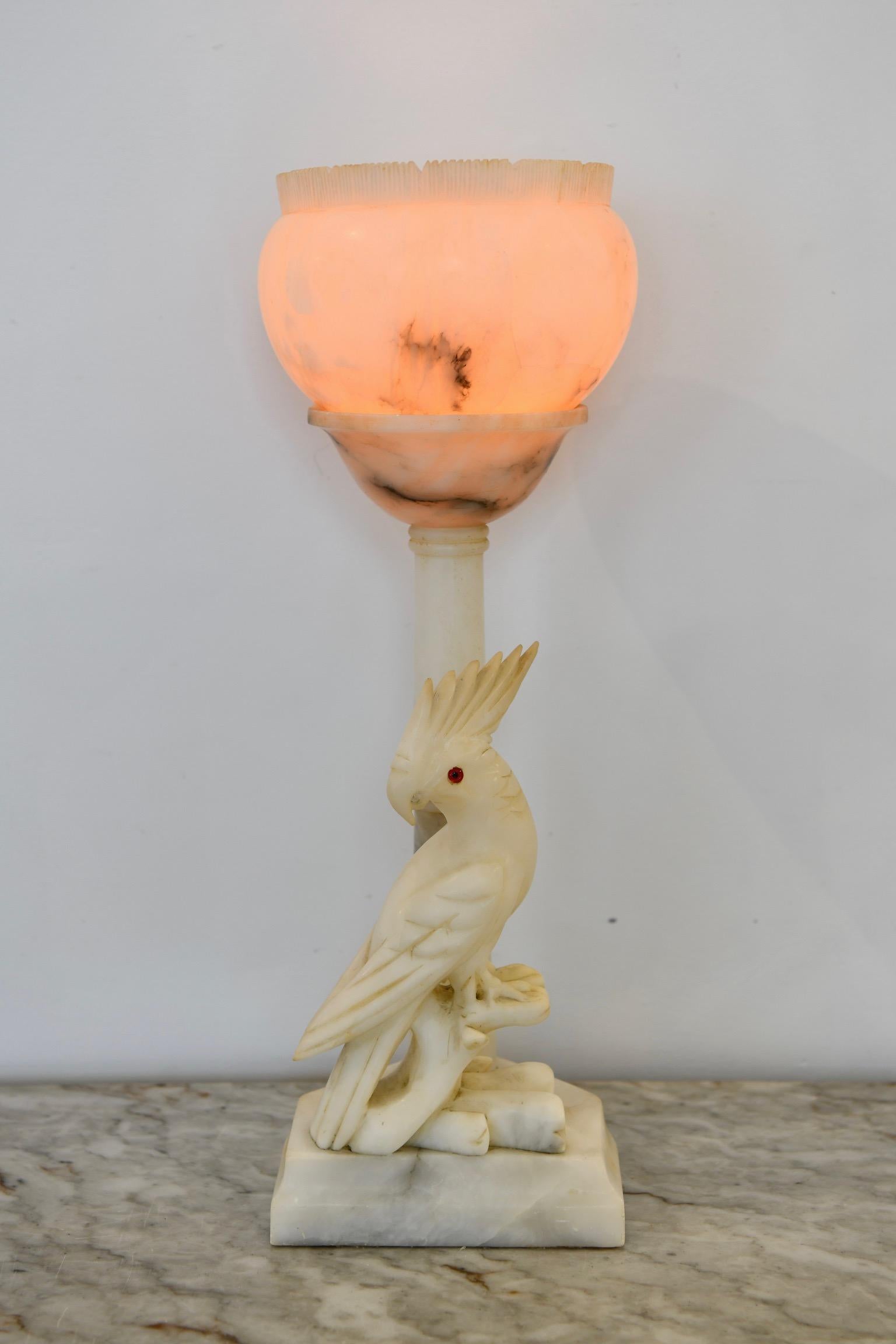 Antique alabaster figural lamp of a cockatoo by a lamppost. Dimensions:  21
