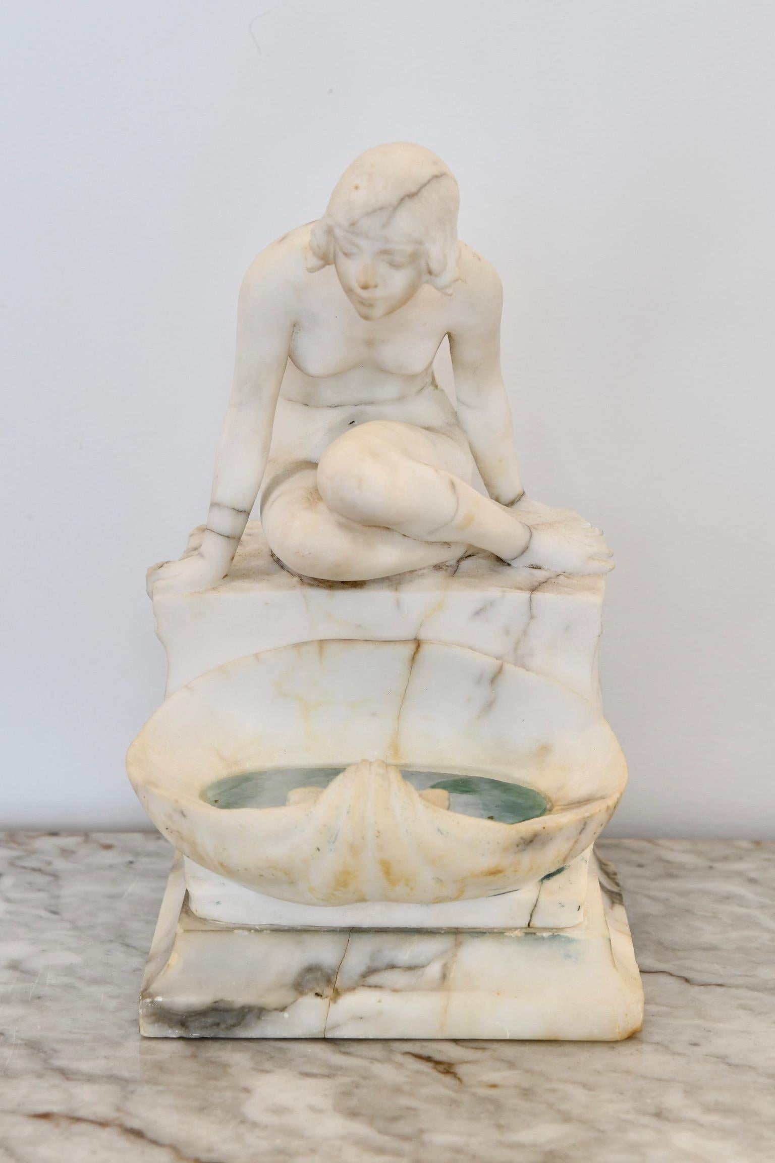 Antique alabaster figural lamp of a lady looking in water. Dimensions: 14.5
