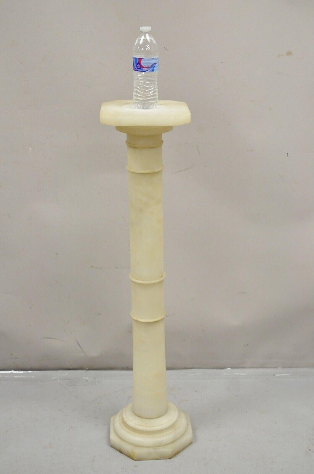 Antique Alabaster Marble Empire Style Carved Column Pedestal Plant Stand. Item features a revolving top, nice slender form, good antique item. Circa Early 20th Century. Measurements: 39