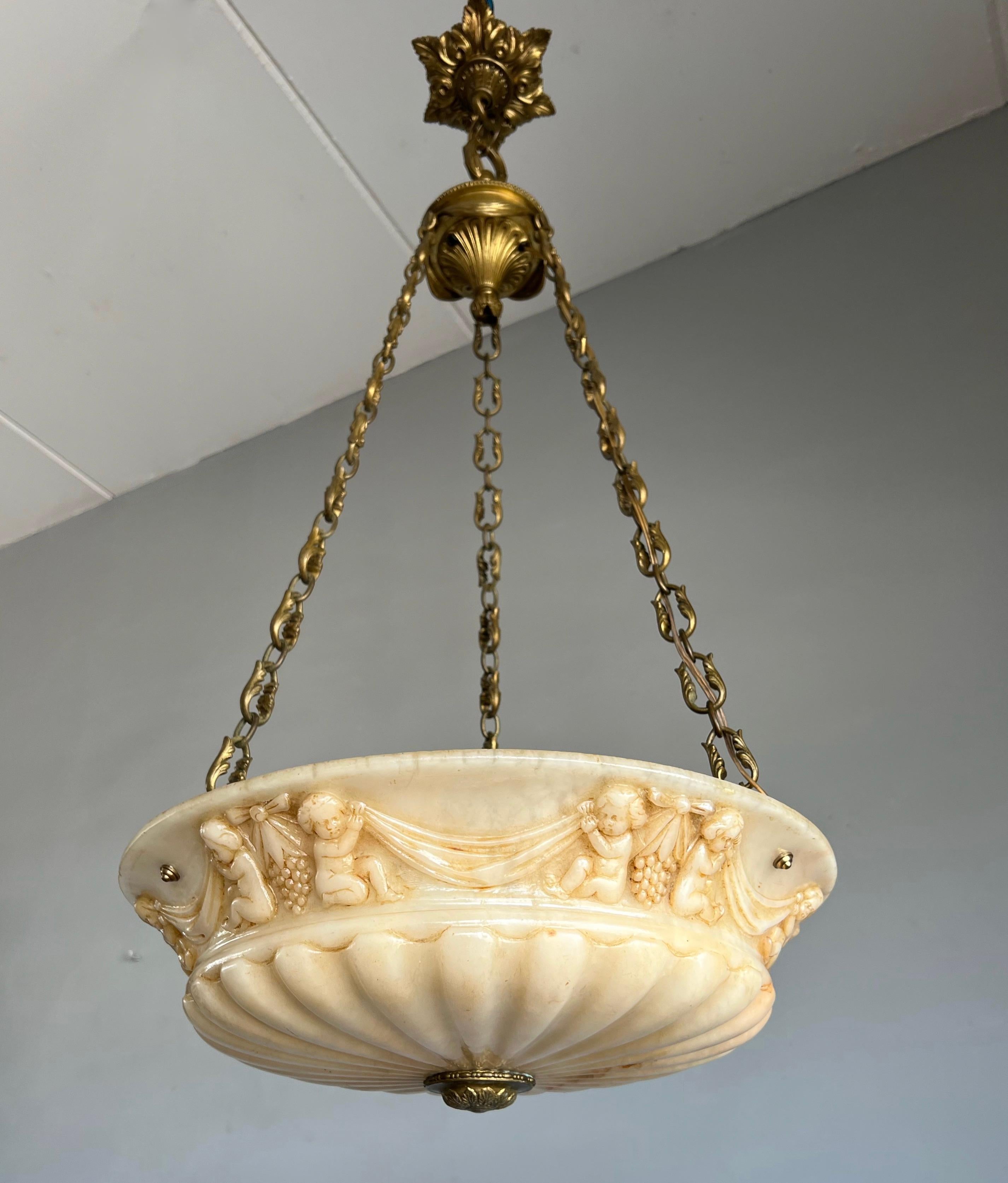 Bronze Antique Alabaster Pendant Light with Impressive Hand Carved Putti Decor For Sale