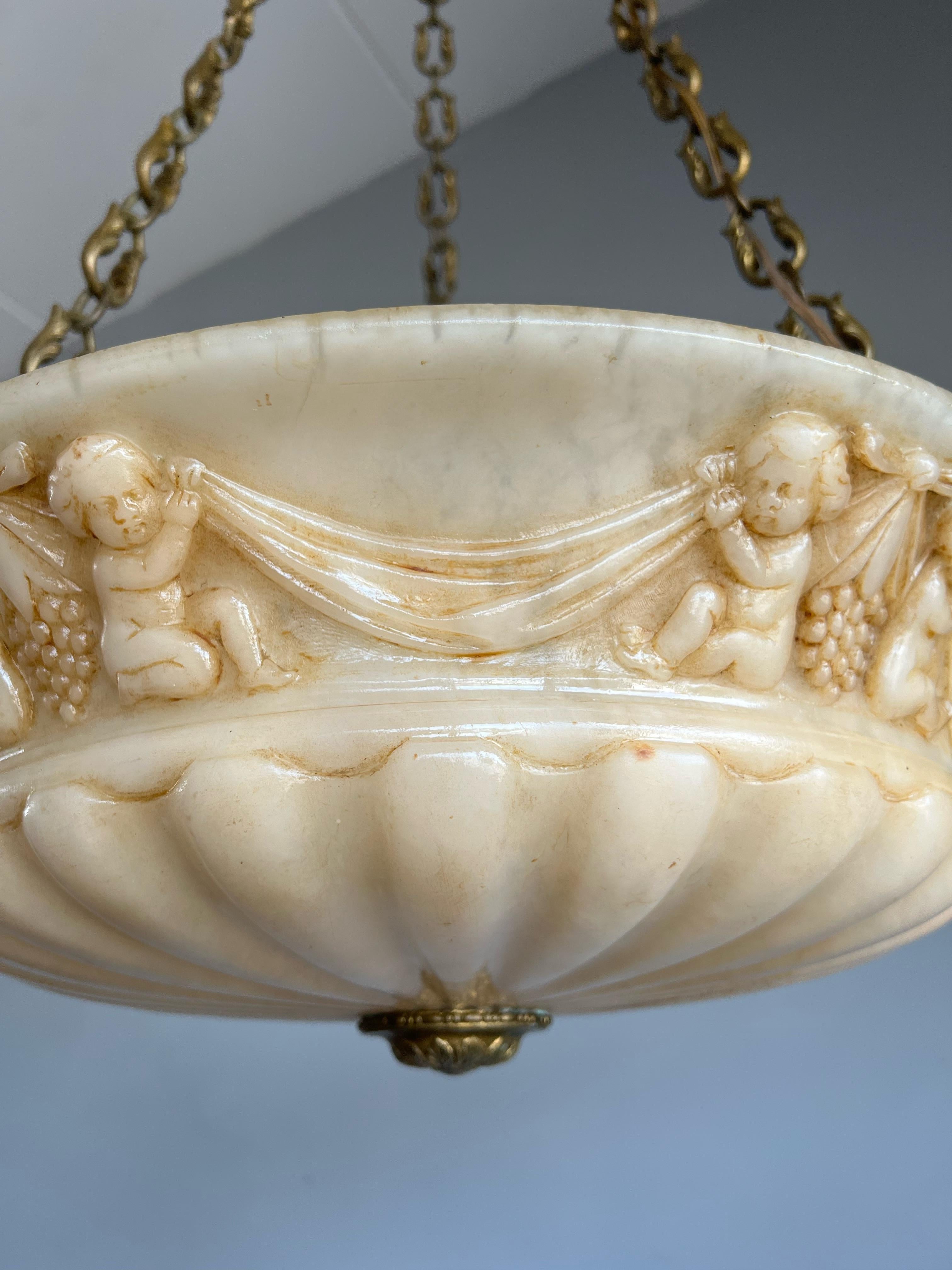 Antique Alabaster Pendant Light with Impressive Hand Carved Putti Decor In Good Condition For Sale In Lisse, NL