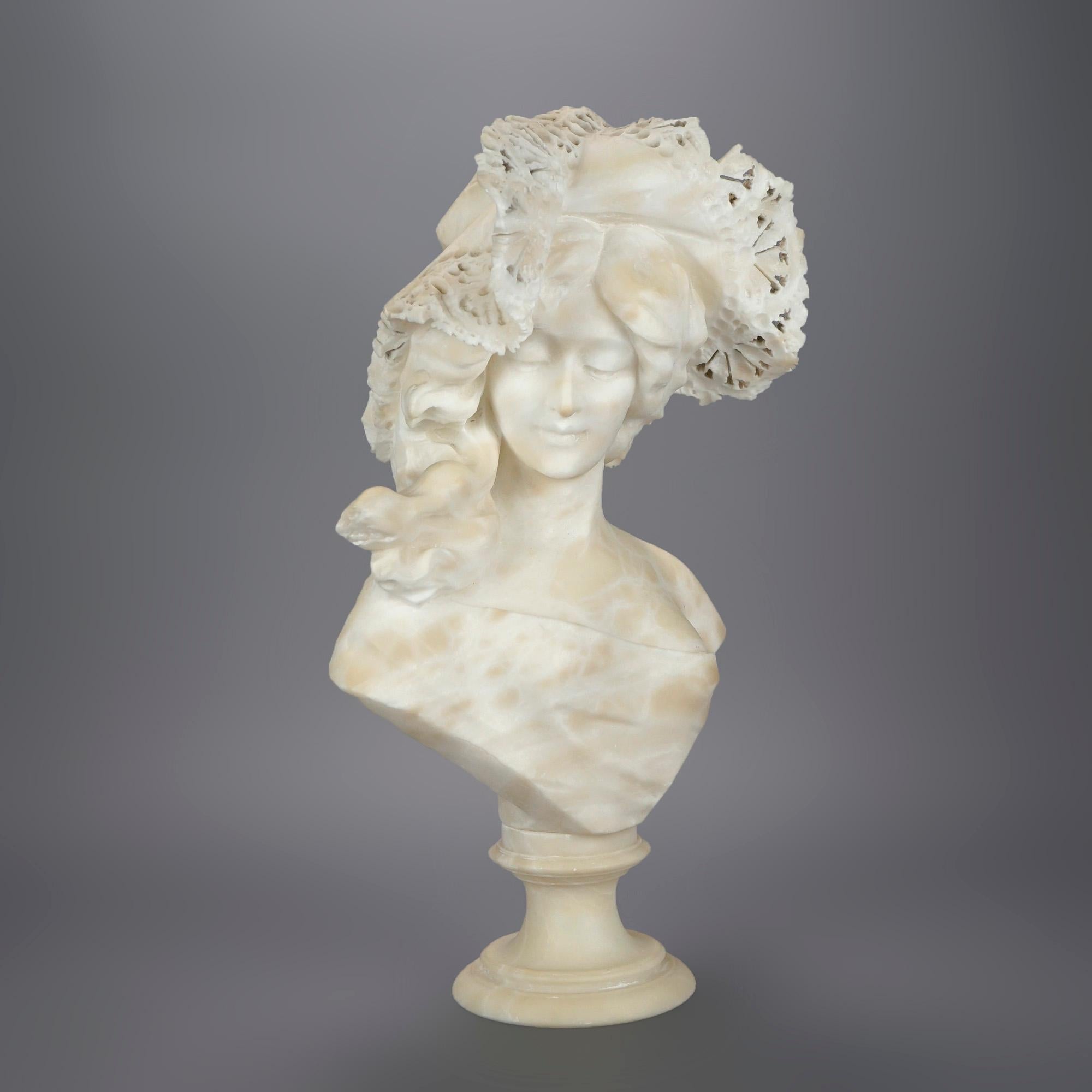 An antique sculpture offers carved alabaster portrait bust of a woman in a lace hat, raised on circular plinth, 19th century

Measures- 22.5''H x 12.5''W x 7''D.