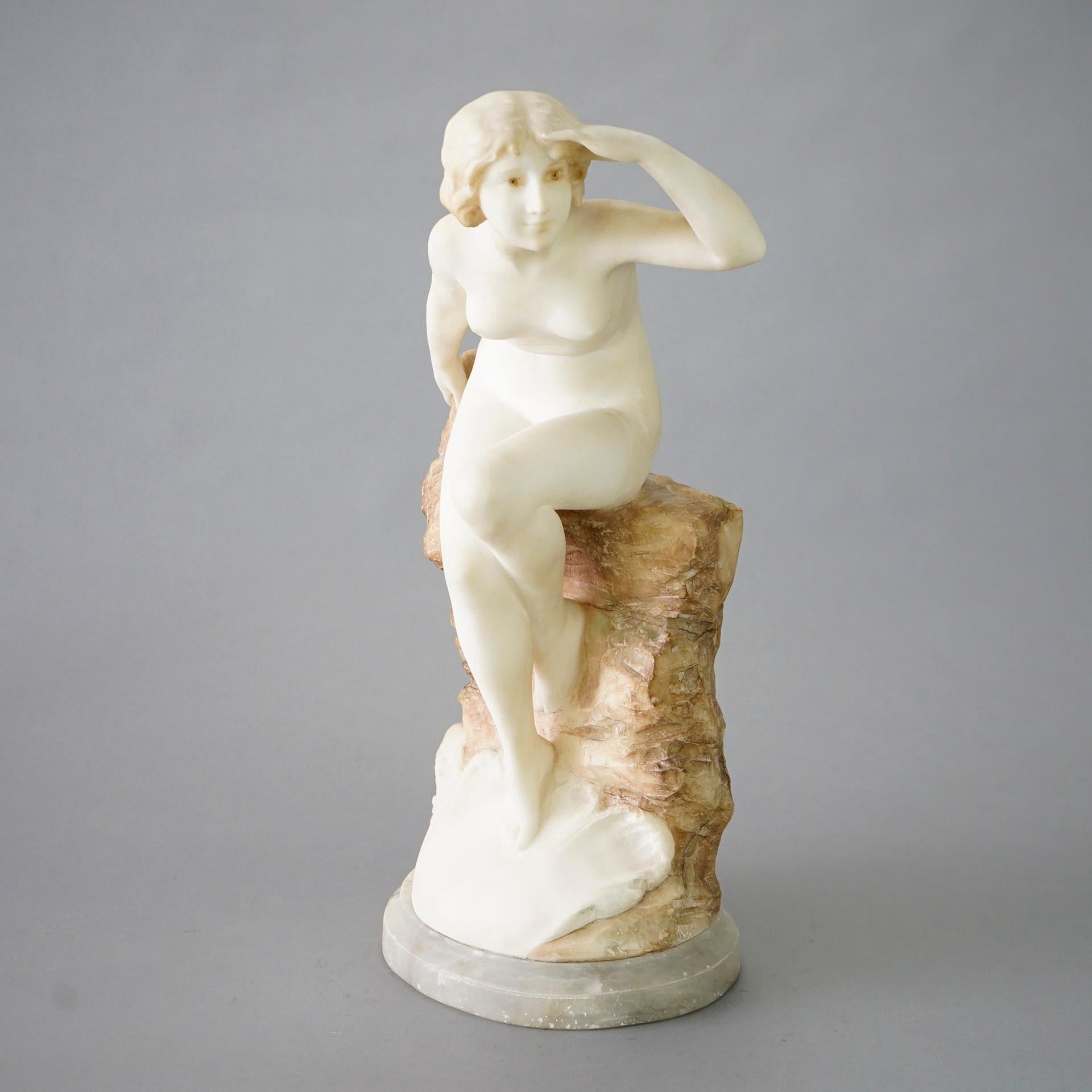 An antique Italian sculpture by A. Del Perugia (Italy, circa 1900) offers carved alabaster portrait of a nude woman seated on a rock over seashore with waves, artist signed as photographed, early 20th century

Measures- 21.75''H x 11.25''W x 8''D.
