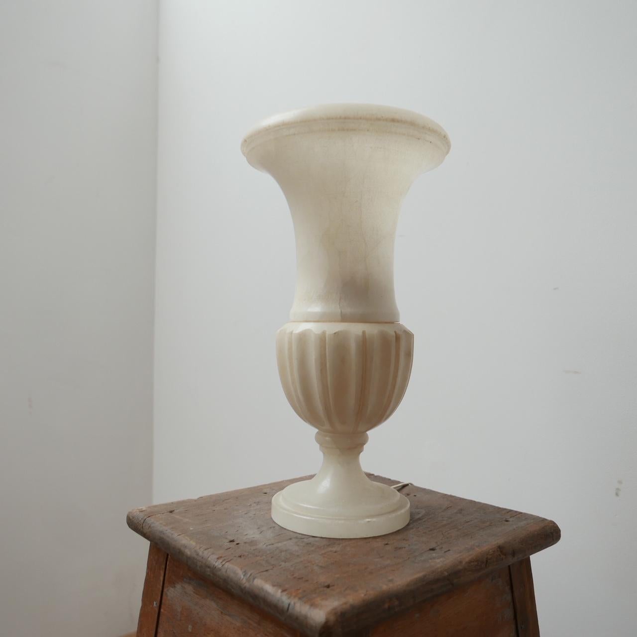 An alabster urn table lamp. 

These look particularly good as part of wider collections. 

Holland, c1930s. 

Good condition with occasional knicks and scuffs commensurate with age. 

Re-wired and good condition. 

Dimensions: 20 diameter