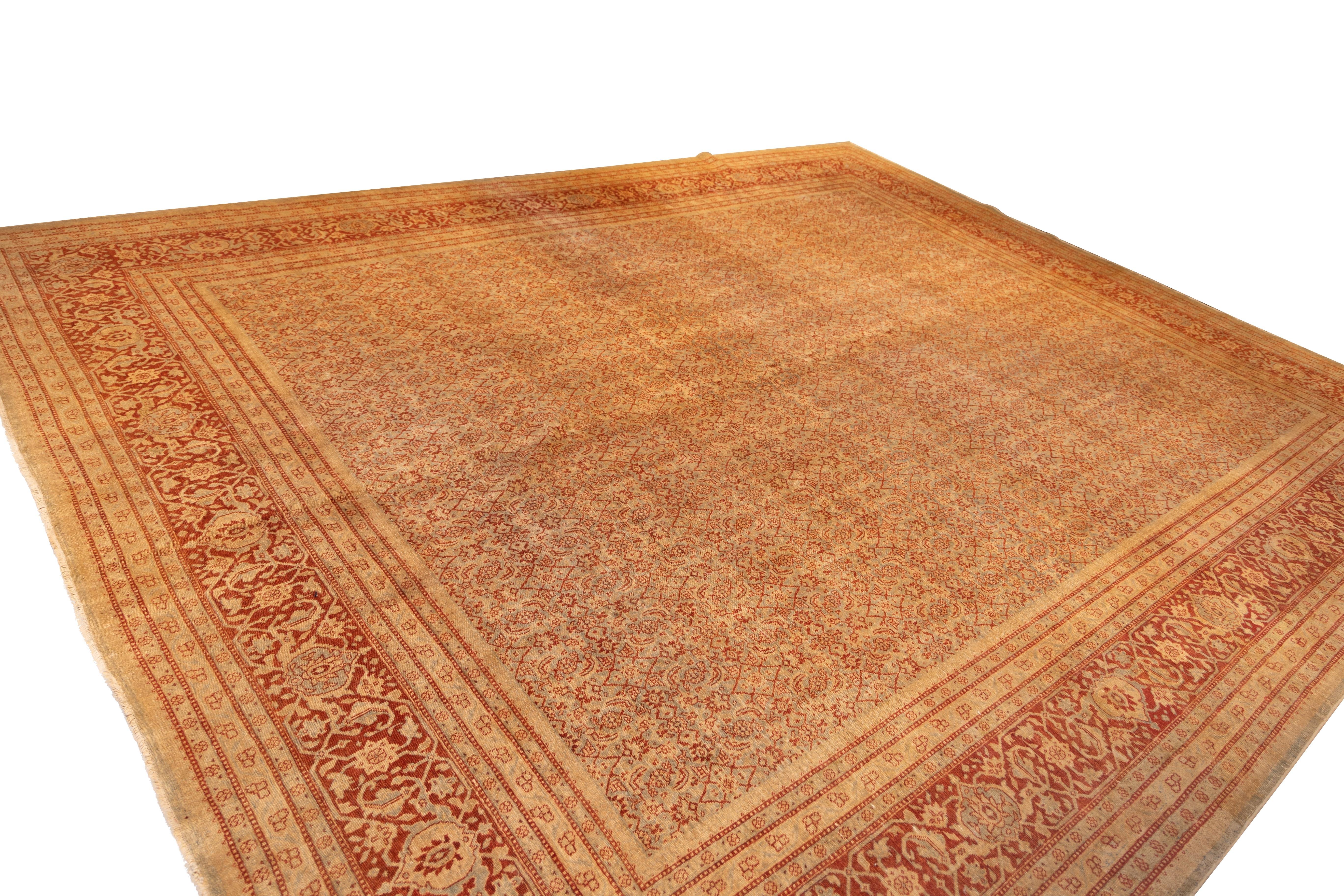 A finely detailed carpet featuring an allover design composed of densely interlaced floral motifs arranged in a precise, repeating lattice. The pattern is executed in a restrained palette of Abrash red, pale gold, and sand, creating a tone-on-tone