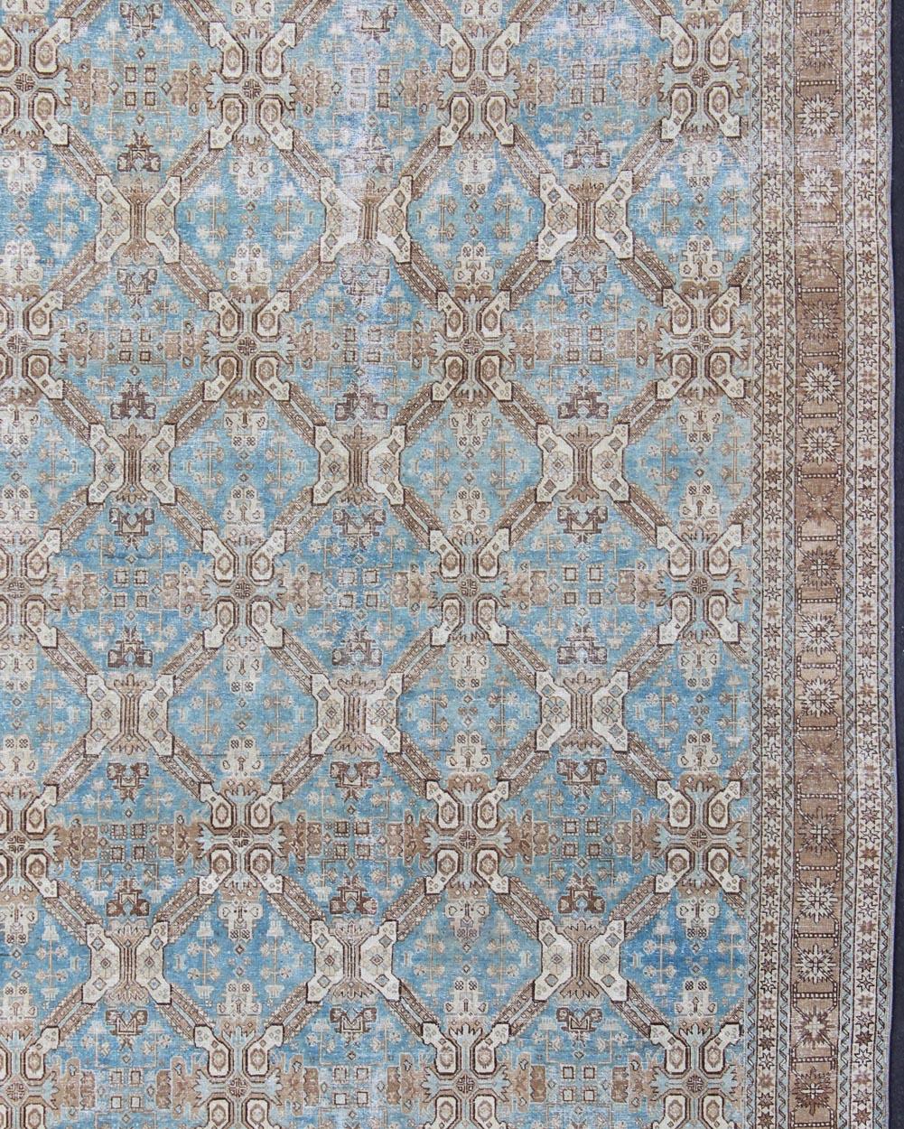 Brown, blue, and taupe geometric Persian Tabriz rug, rug SUS-1908-22, country of origin / type: Iran / Tabriz, circa 1920

This antique Tabriz carpet from 1920s Persia features a field filled with an all-over design interconnected geometric