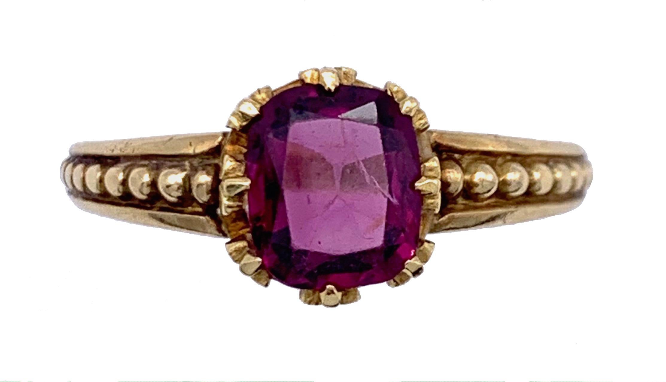 Elegant almandin garnet ring in a fine claw setting. The ring shank is decorated with balls, as the shank distances itself from the centre stone the balls decrease in size. Thevgarnet has an inmtensive deep pinkish violet hue.
The garnet in it's
