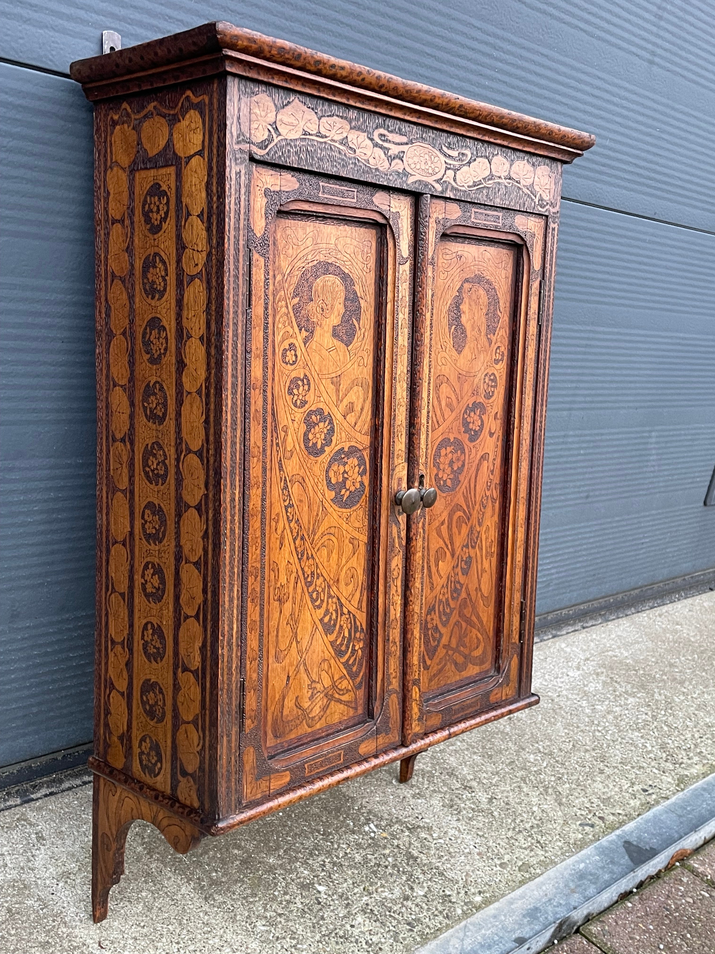 One of a kind cabinet with rare pokerwork decoration.

This multi-fuctional, practical size, easthetically pleasing and all handcrafted wall cabinet is in very good condition and it is an absolute joy to own and look at. What makes this rare wall