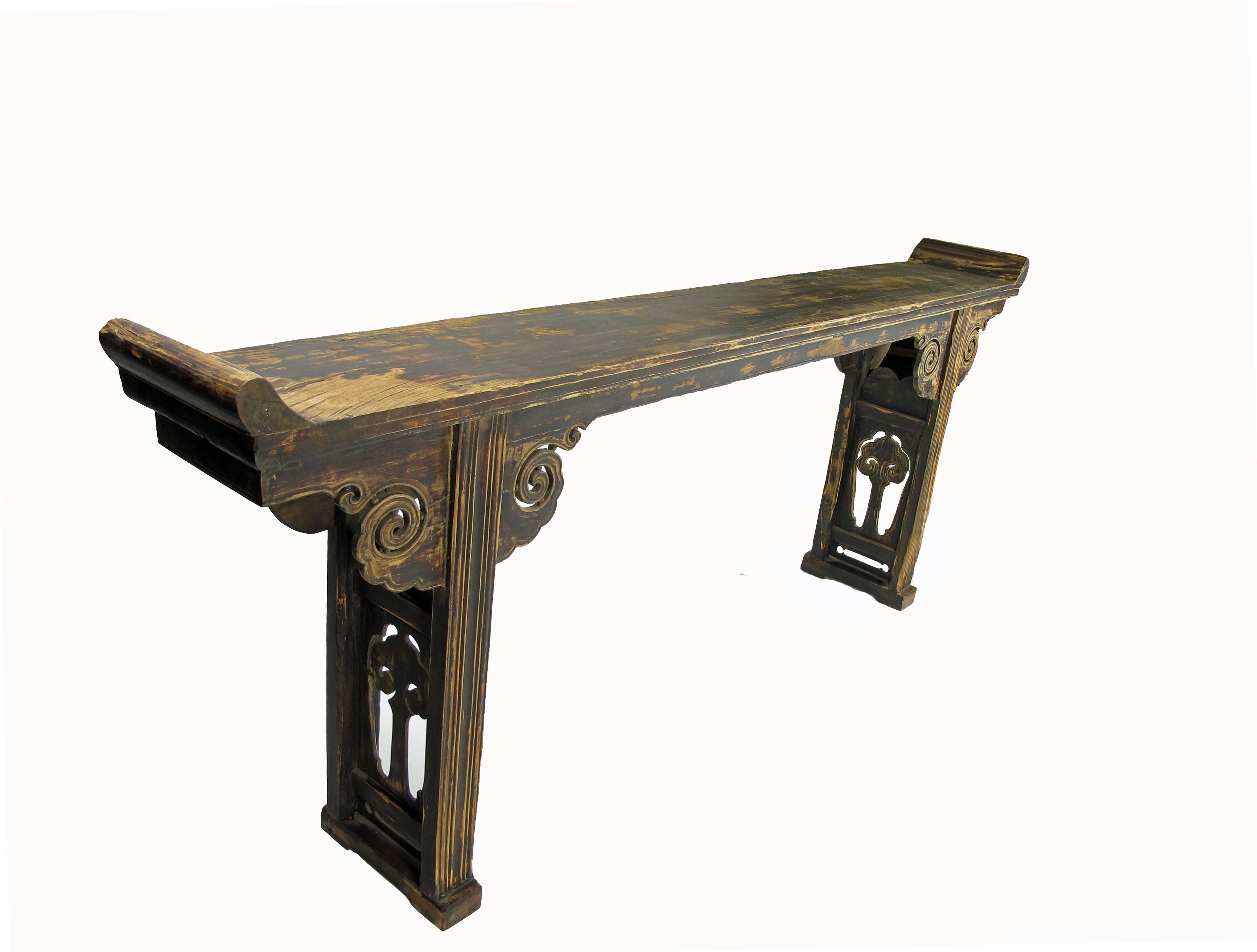 Measuring over 7 feet long, this striking long altar table could either go against a wide wall or function as a room purpose divider in an open space. The legs are made of two open carved of double Ruyi. Ruyi is literally “as desired” or “as you