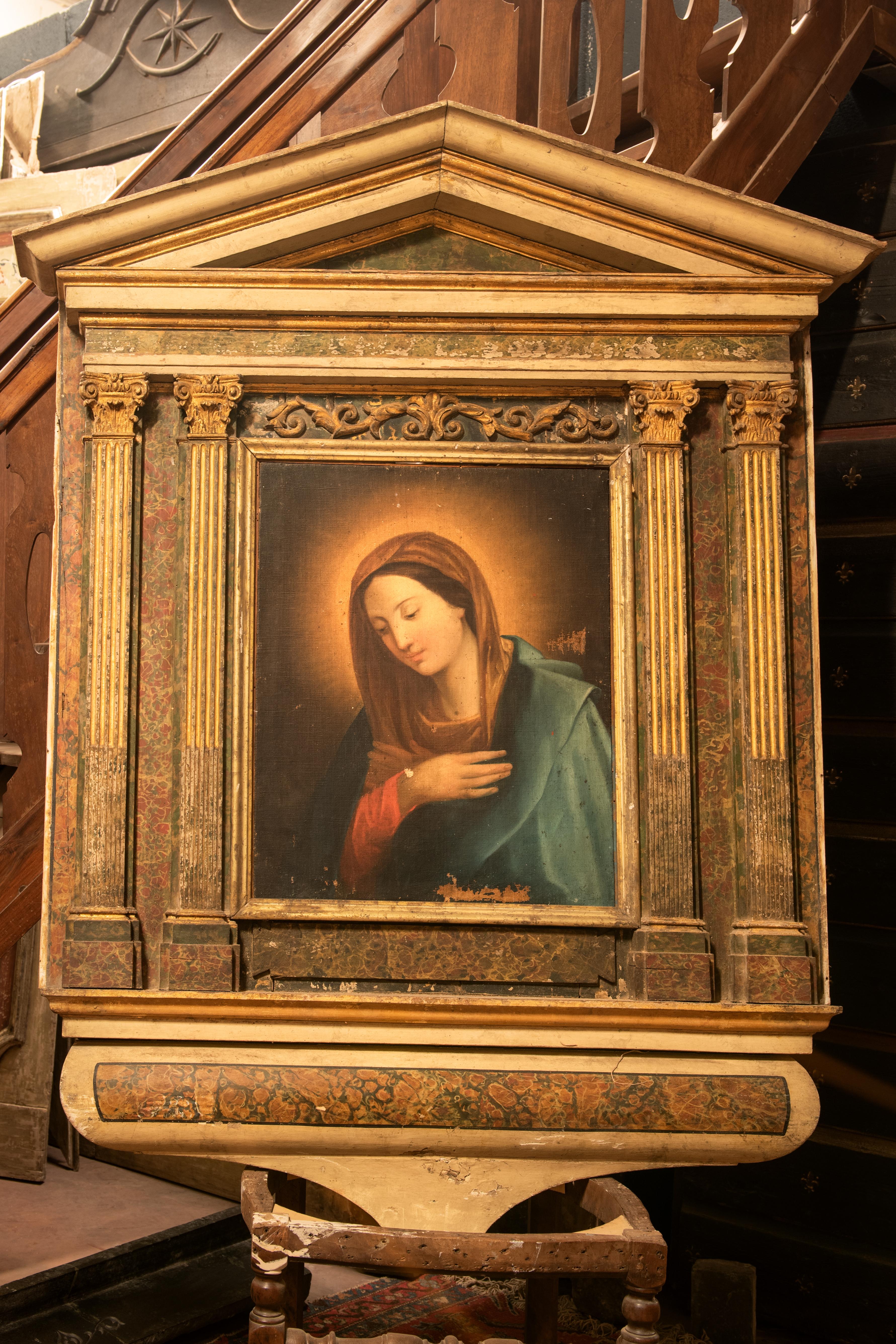 Ancient altarpiece in carved and painted wood, depicting the Madonna painted on canvas, frame with gilded painted wooden columns, 18th century, from an Italian church, measuring cm W 145 x H 167.
Possibility of using it in a different way, as wall