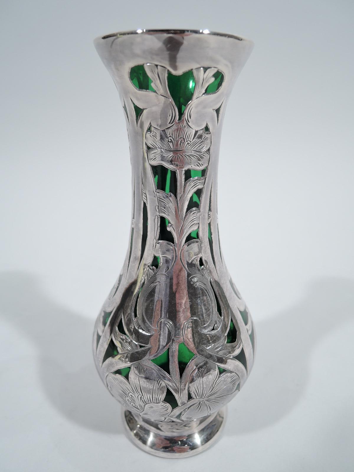 Turn-of-the-century Art Nouveau glass vase with engraved silver overlay. Baluster with dense and vertical overlay in form of entwined stem flowers in curvilinear frames. Scrolled cartouche (vacant). Glass is green. Fully marked including maker's