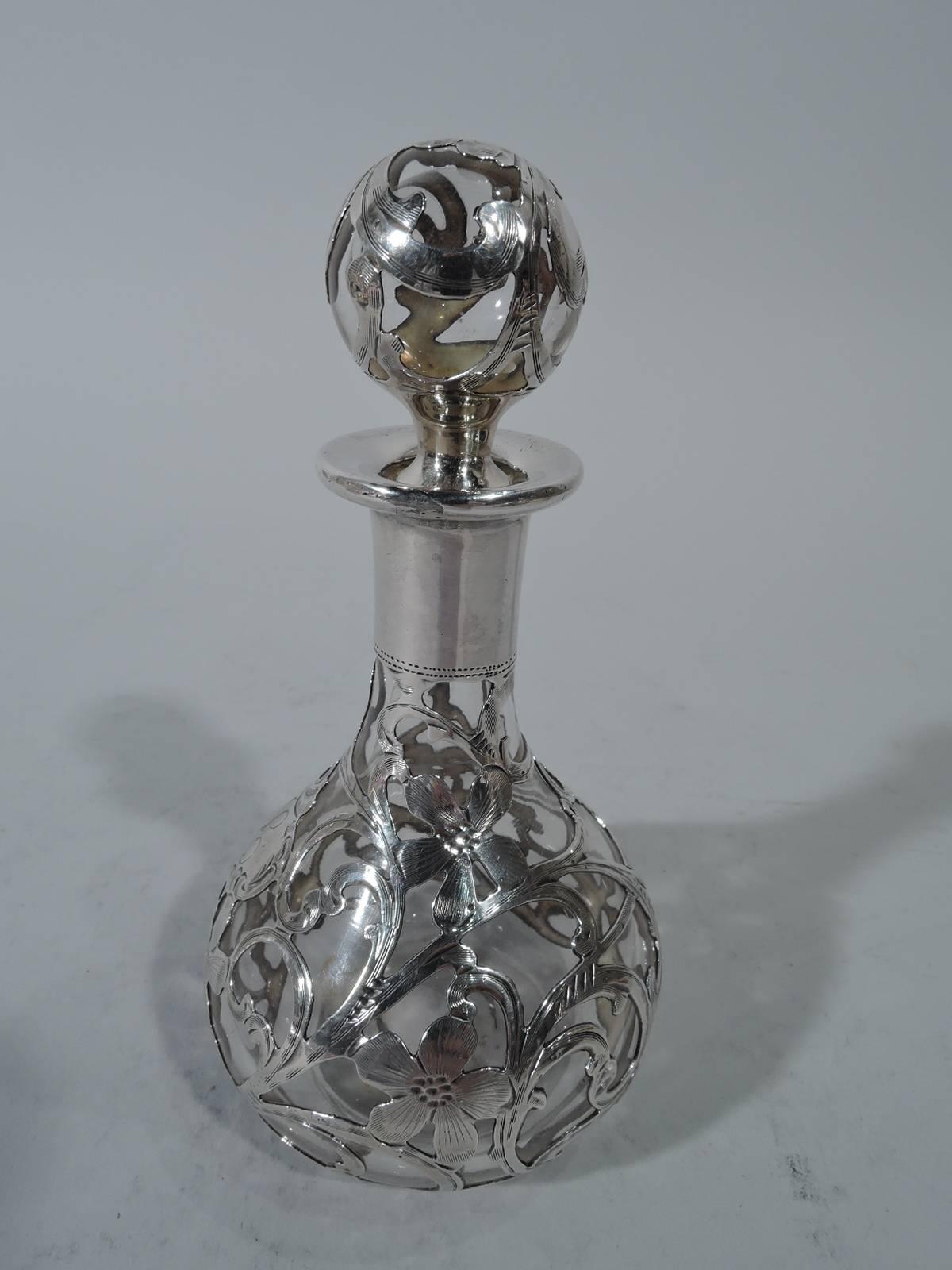 Art Nouveau silver overlaid glass perfume bottle and stopper. Made by Alvin in Providence. Bottle globular with cylindrical neck. Ball stopper with short and tapering plug. Silver overlay heightened with engraving: Fluid foliate scrollwork and