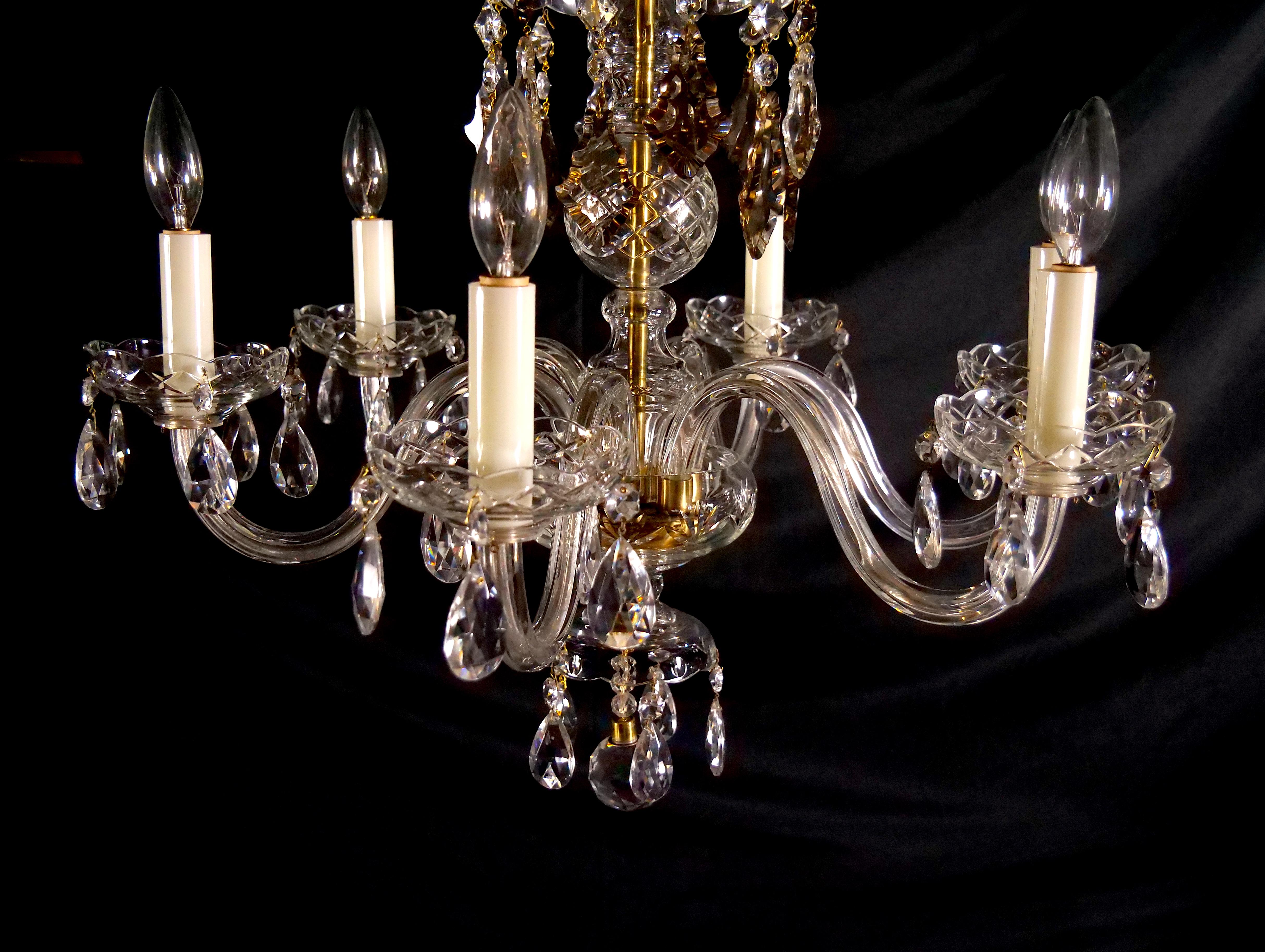 Elevate your space with the timeless allure of this Antique Cut Crystal Six-Light Chandelier. This chandelier is a true embodiment of classic elegance and craftsmanship, meticulously designed to illuminate and captivate. The chandelier features a