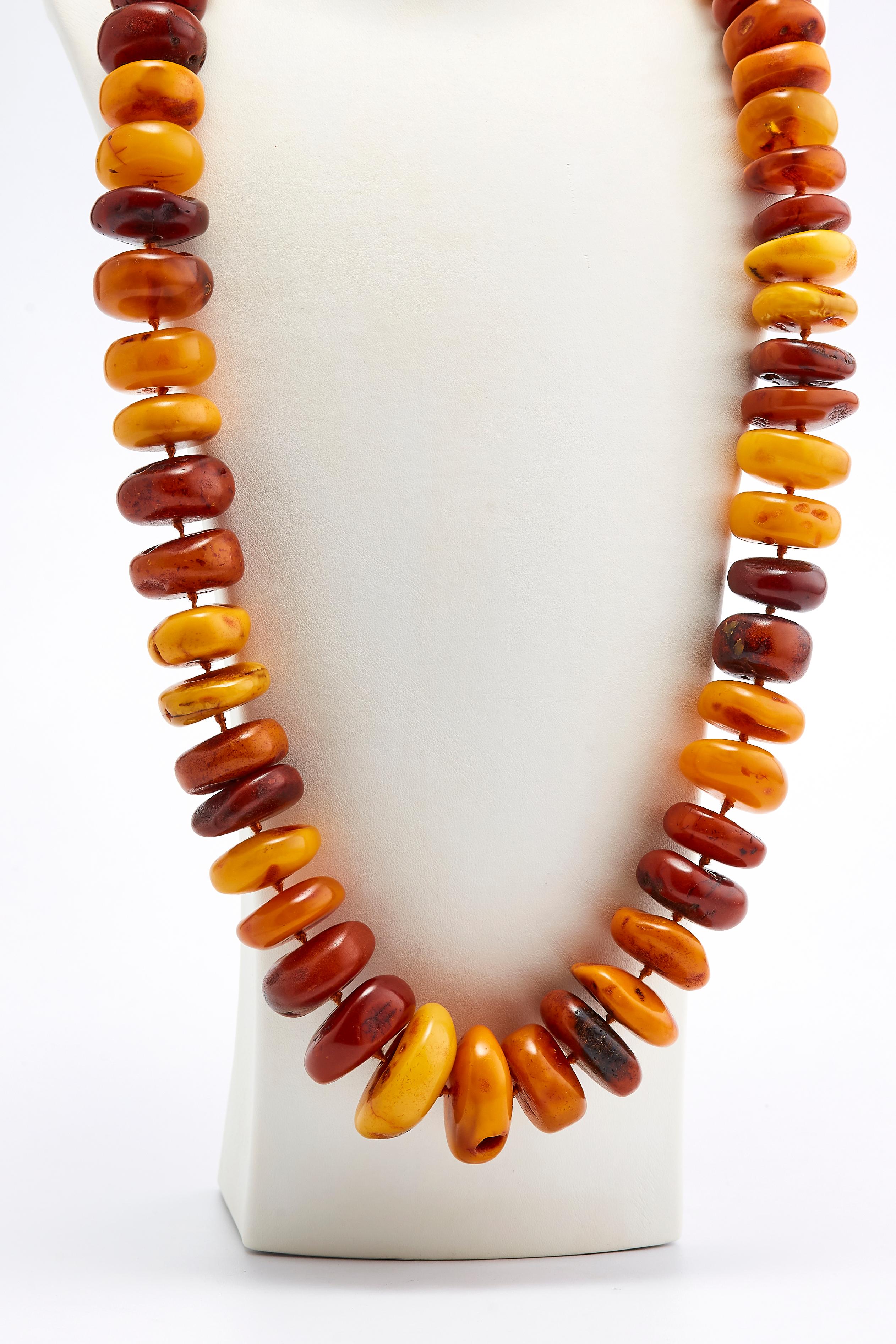 Antique Amber Necklace

Gorgeous Amber necklace with stunning bright colors of orange, red, brown and yellow. 
The necklace was made in Russia in the 1890s.
 Total weight: 330 grams.