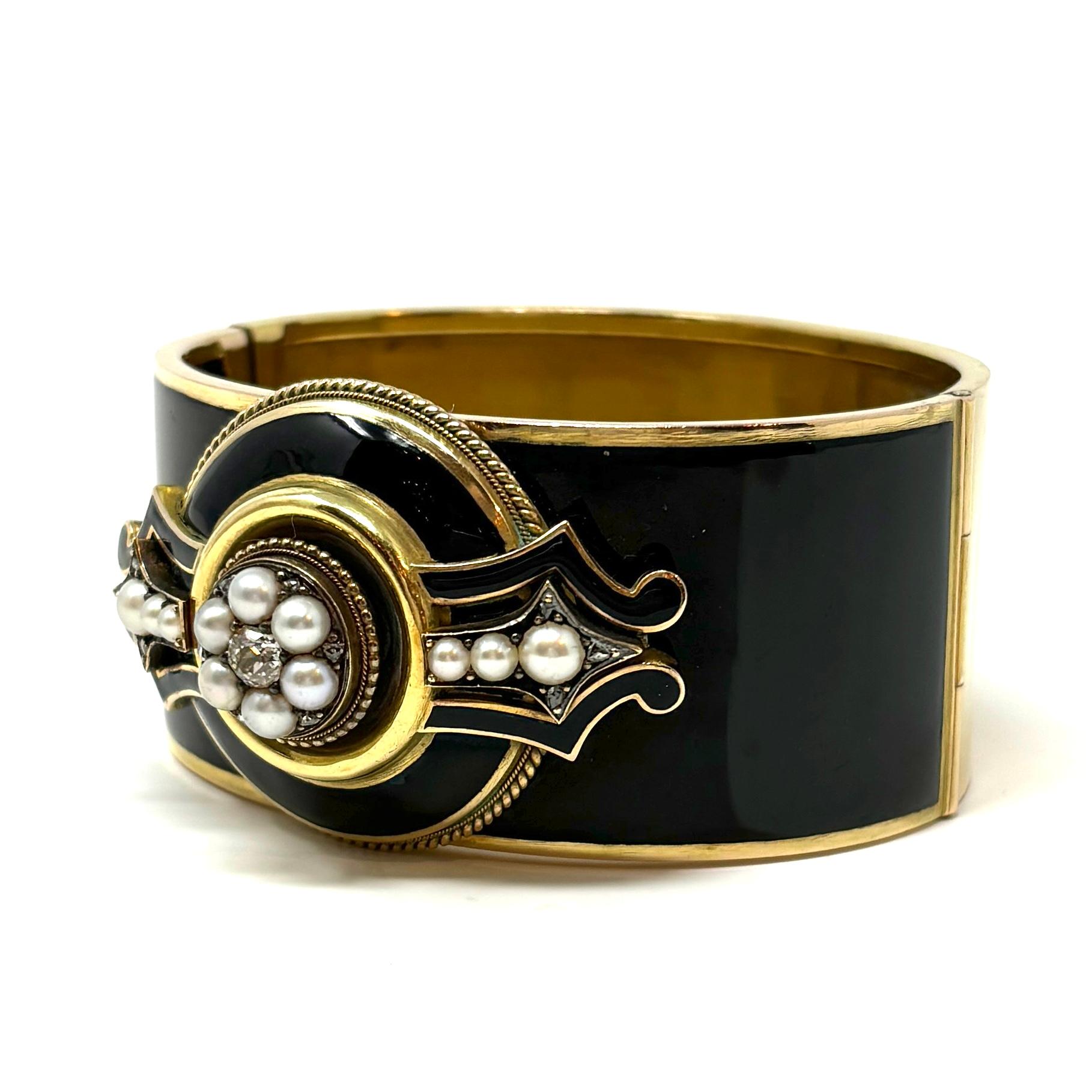 A fantastic Victorian black enamel bracelet set with natural pearls and old mine cut diamonds. 

1 3/8