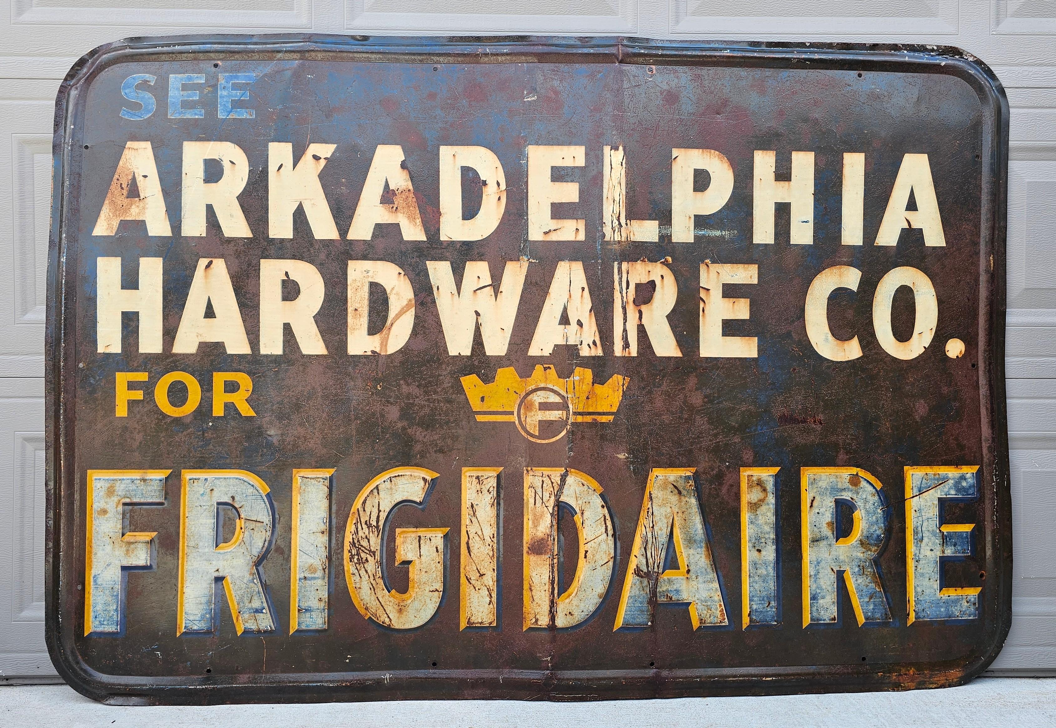 A scarce, likely one-of-a-kind, antique American Frigidaire enameled metal advertising sign, early 20th century, period Art Deco styling, the sign reads: 