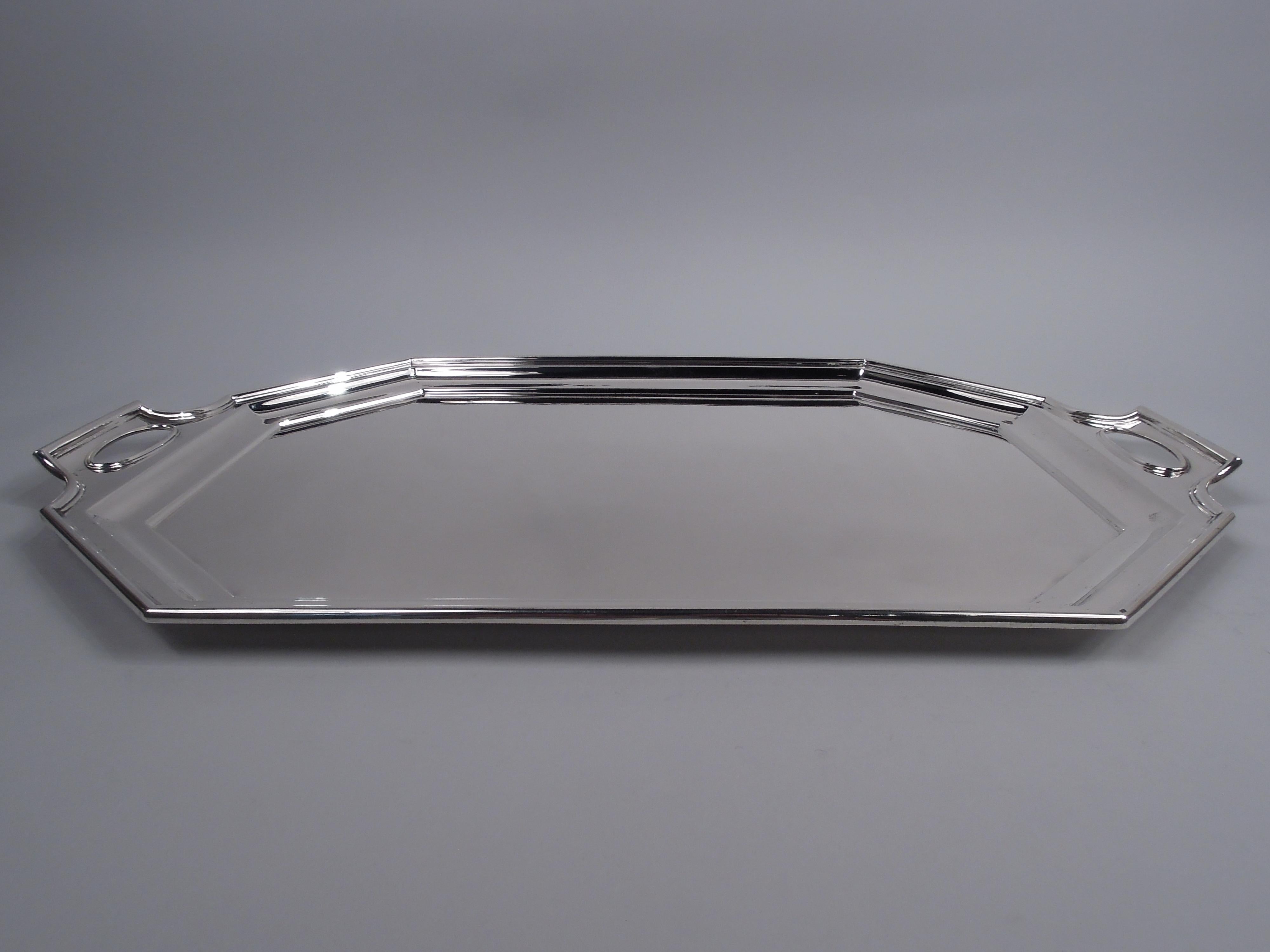 Fairfax sterling silver tea tray, ca 1920. Retailed by Black, Starr & Frost in New York. Rectilinear with chamfered corners and shaped ends with cutout oval handles. A beautiful piece in the Art Deco pattern that was made by Gorham and Durgin. Marks