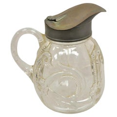 Antigua jarra de jarabe cremera de vidrio emplomado decorada al estilo Art Nouveau americano