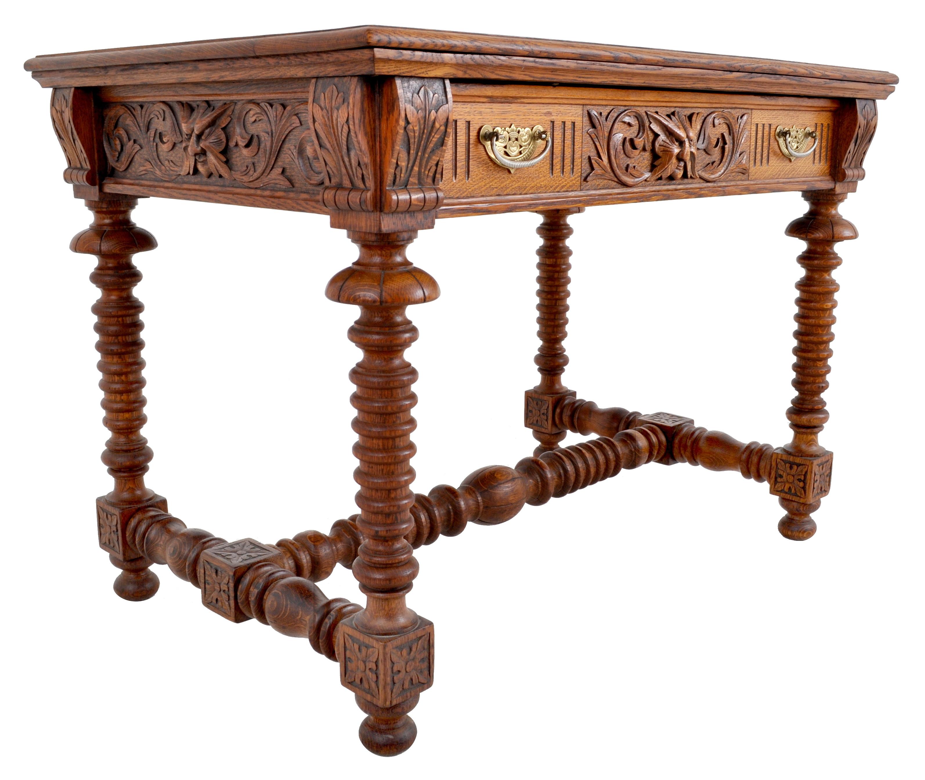 Antique American Arts & Crafts carved oak library / writing table / desk in the style of R. J. Horner, circa 1890. The table having a shaped top supported by corbel brackets decorated with carved stylized oak leaves, the front having a single-drawer