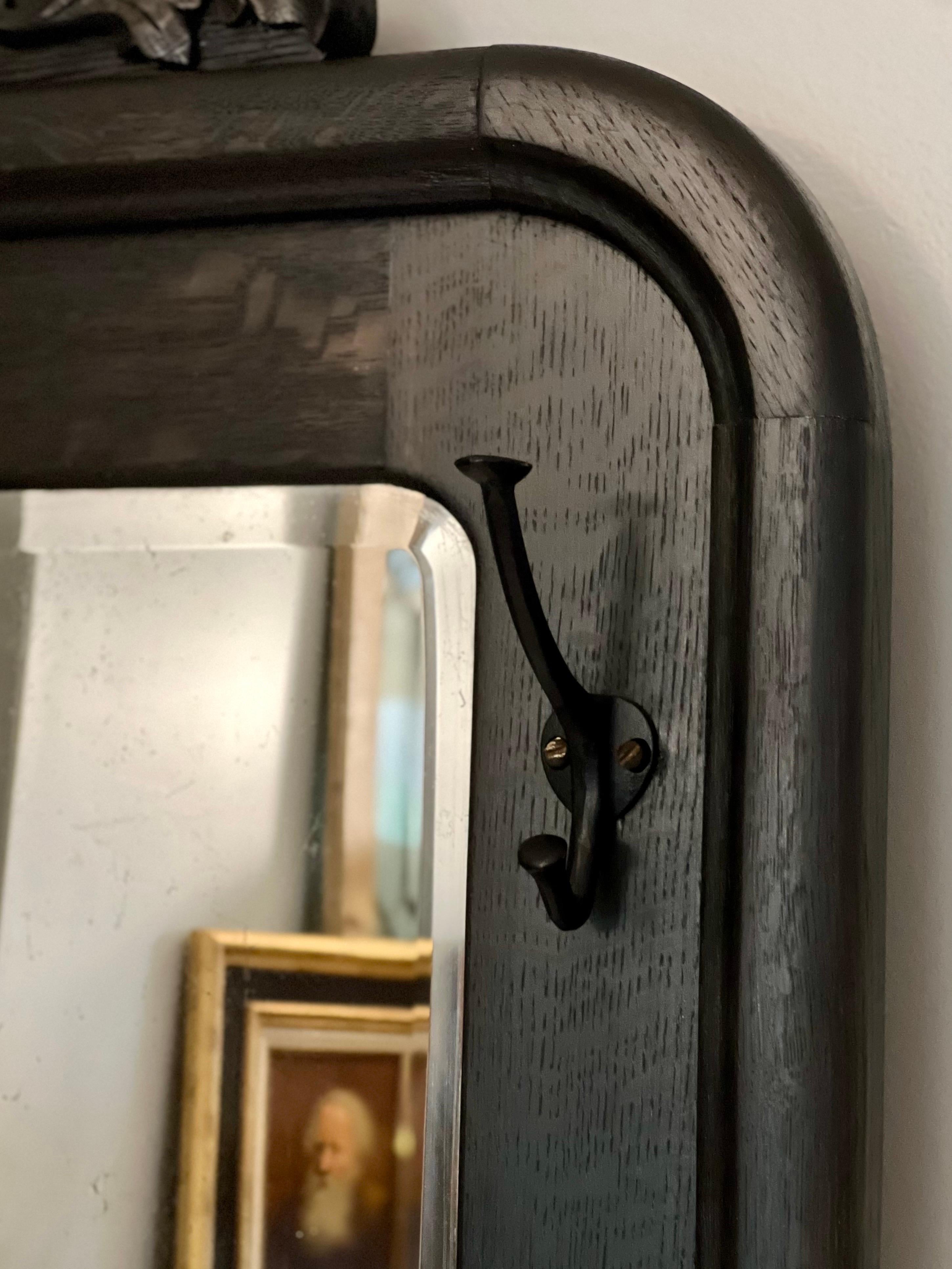 20th Century Antique American Black Stained Oak Wall Coat Rack with Large Beveled Mirror For Sale