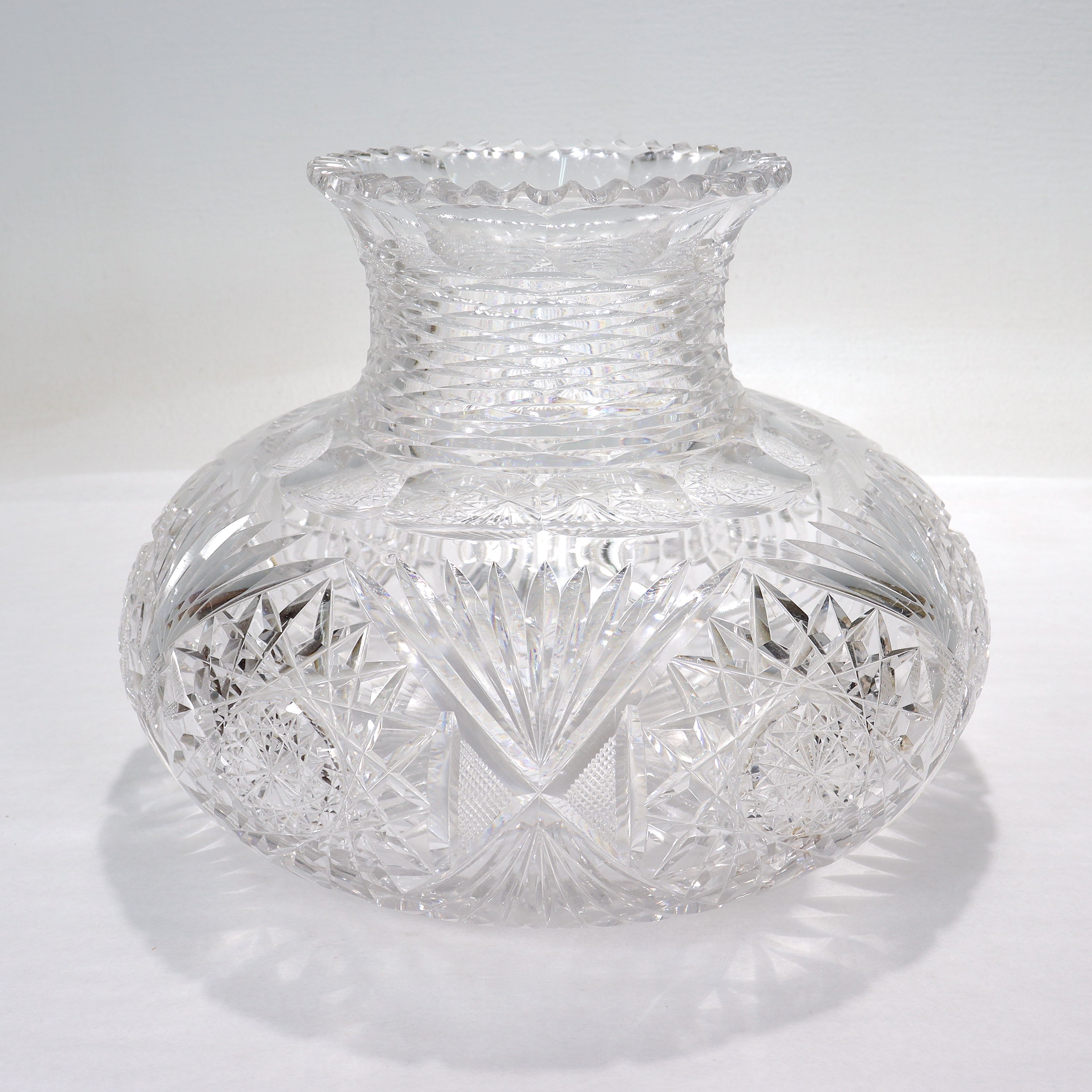 A fine antique American Brilliant Period cut glass vase.

In the form of a large squat vase.

With cut sunburst pattern decoration on both the base and circumference, and a scalloped rim. 

Simply a lovely, large ABP vase!

Date:
Late 19th