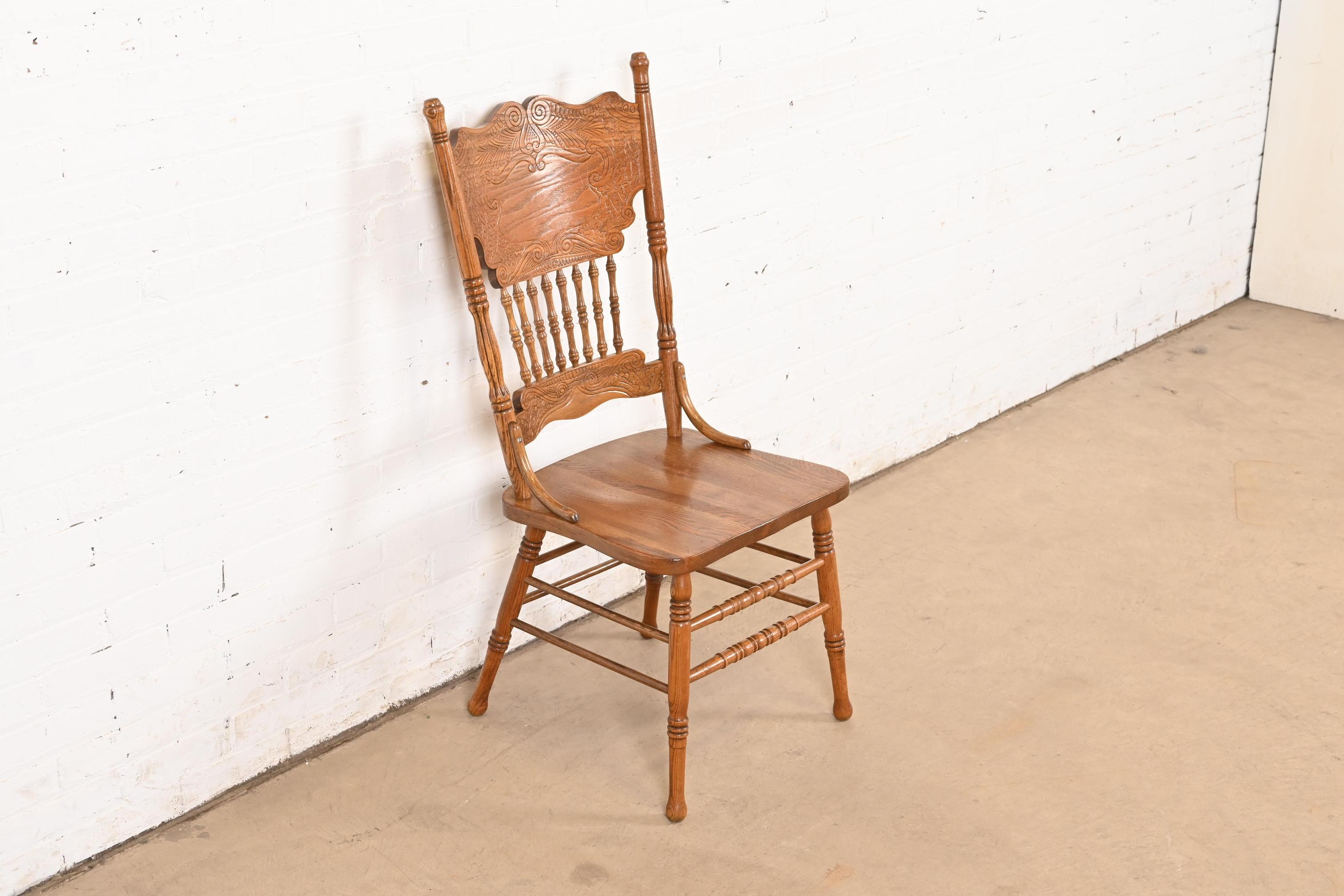 20th Century Antique American Carved Oak Pressed Back Spindle Dining Chair or Side Chair