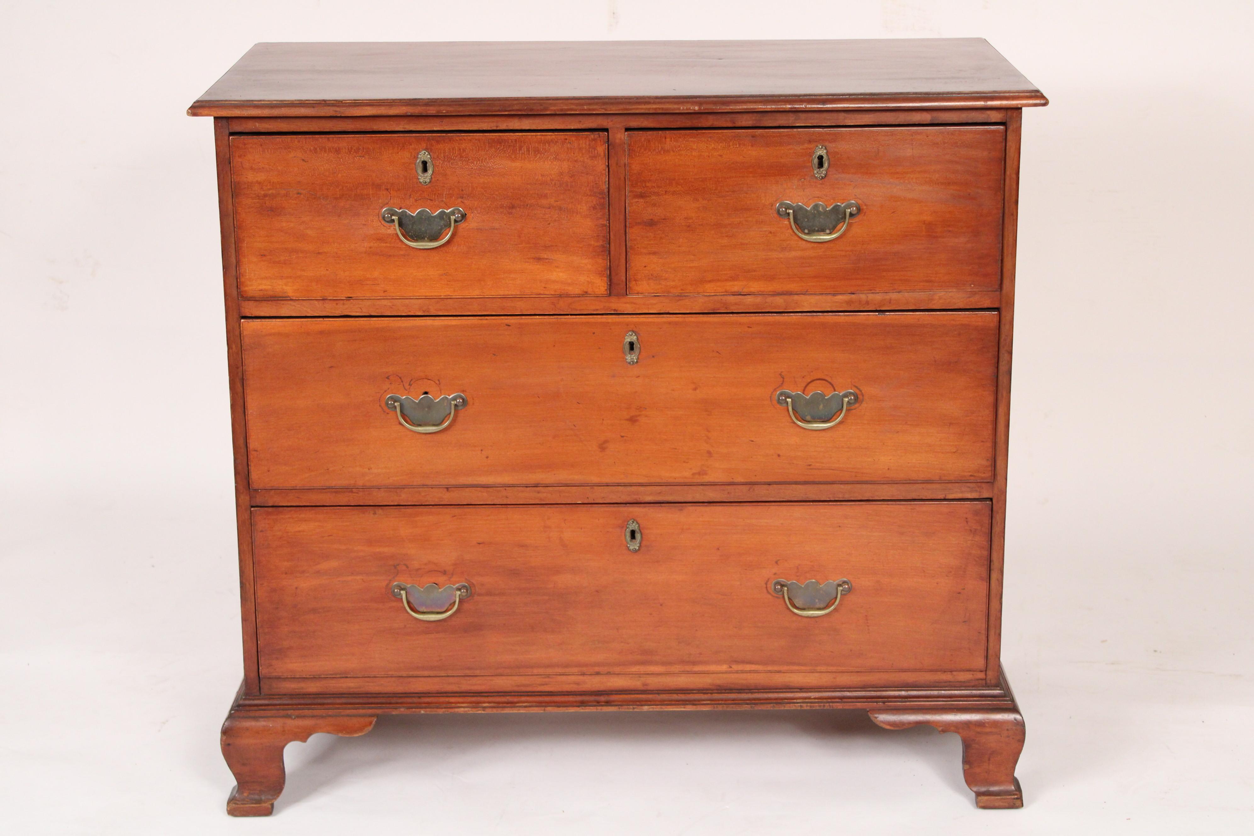 Antique American cherry wood chest of drawers with ogee bracket feet, 19th century.