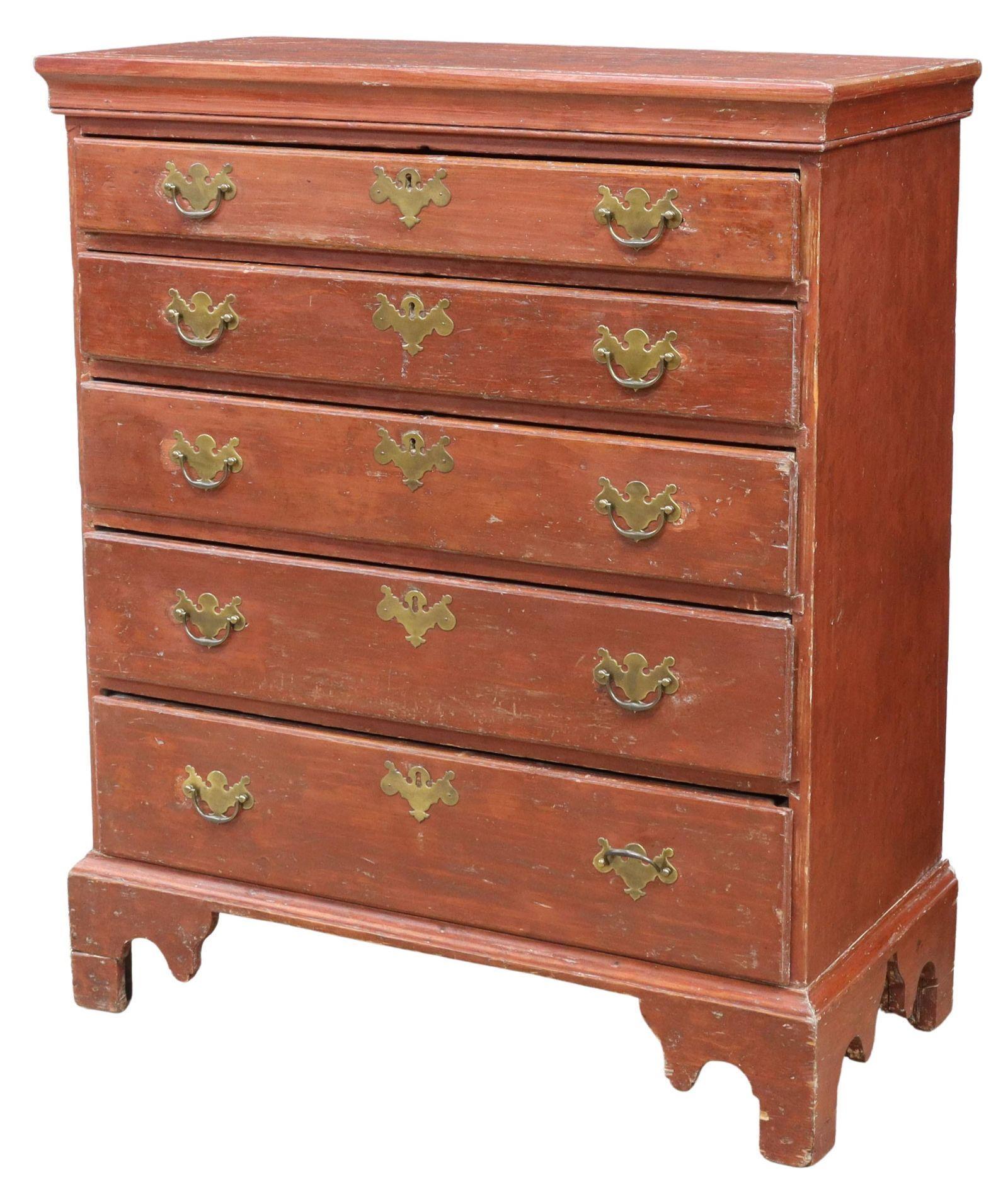 Chippendale Red-painted Chest of Drawers, New England, late 18th century. This chest features a molded pine case, having single-board top with large visible dovetails, fitted with five drawers, rising on shaped bracket feet, later brass bat-wing