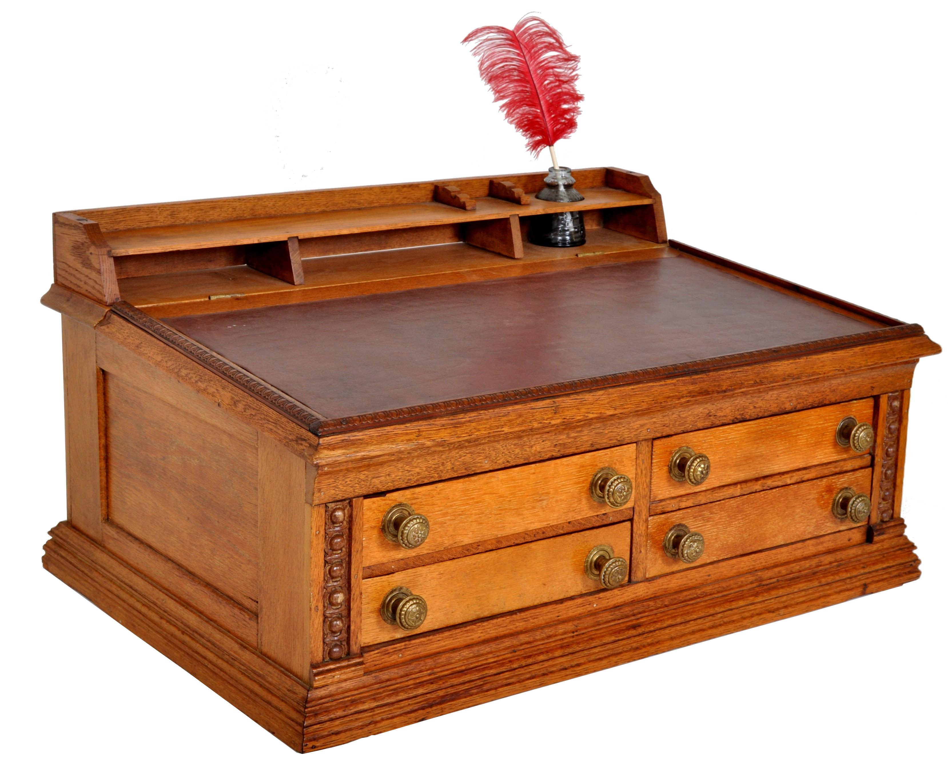 Antique American Clark's O.N.T. oak spool cabinet/mercantile desk, circa 1900. The top with fitted inkwell and pigeon holes. The lift-up sloped writing surface fitted with leather and enclosing a storage reservoir for papers. The base having four