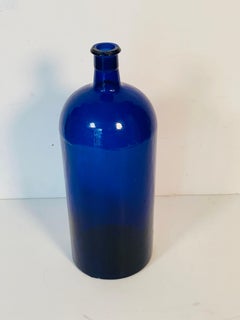 Ancienne bouteille américaine en verre bleu cobalt 14".