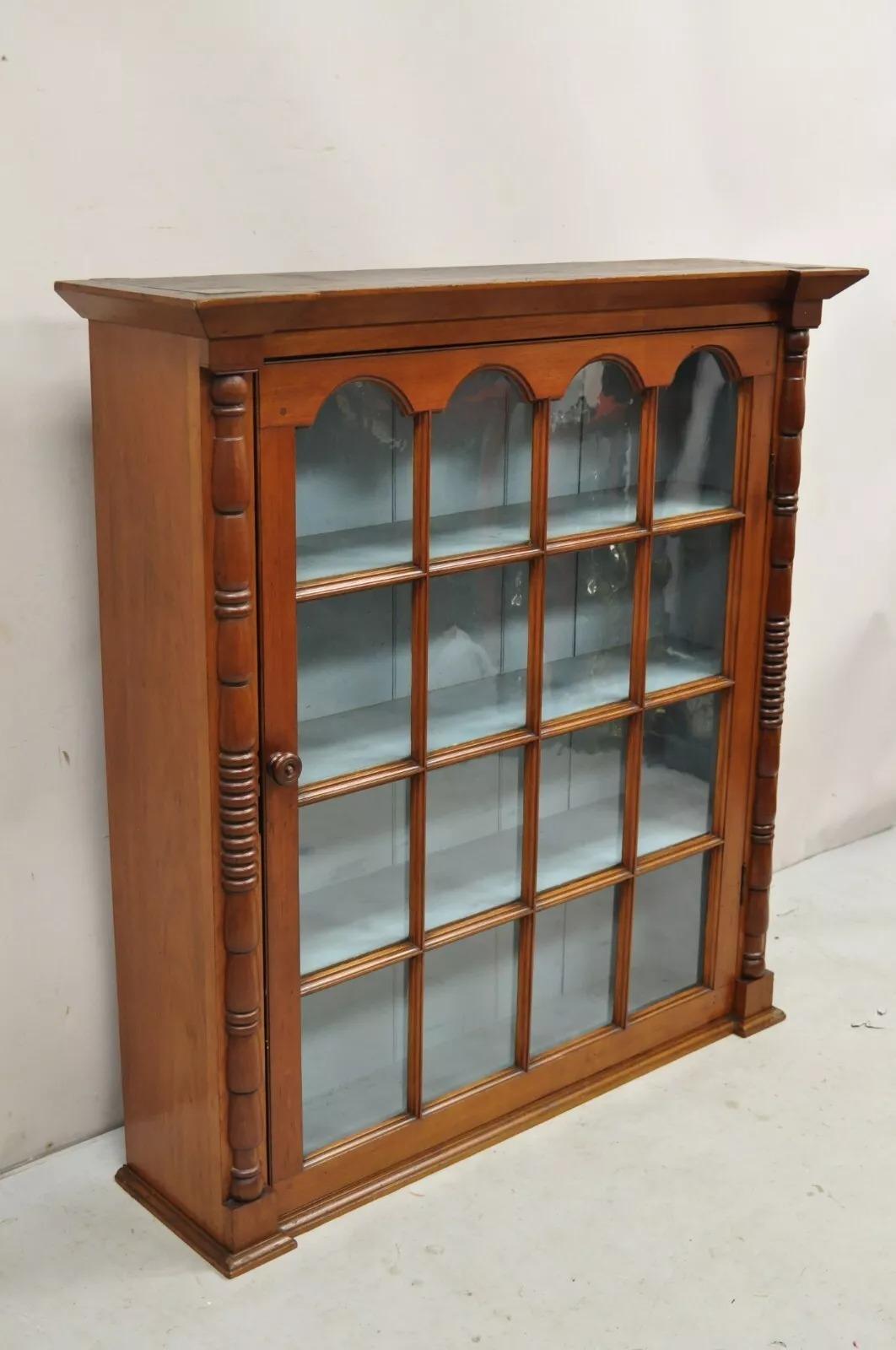 Antique American Colonial Cherry Wood Wavy Glass Door China Cabinet Hutch Top. Item features individual panes of antique wavy glass, blue painted interior, solid wood construction, quality American craftsmanship. Circa Late 19th Century.