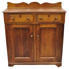Antiguo armario colonial americano primitivo de caoba con 2 cajones