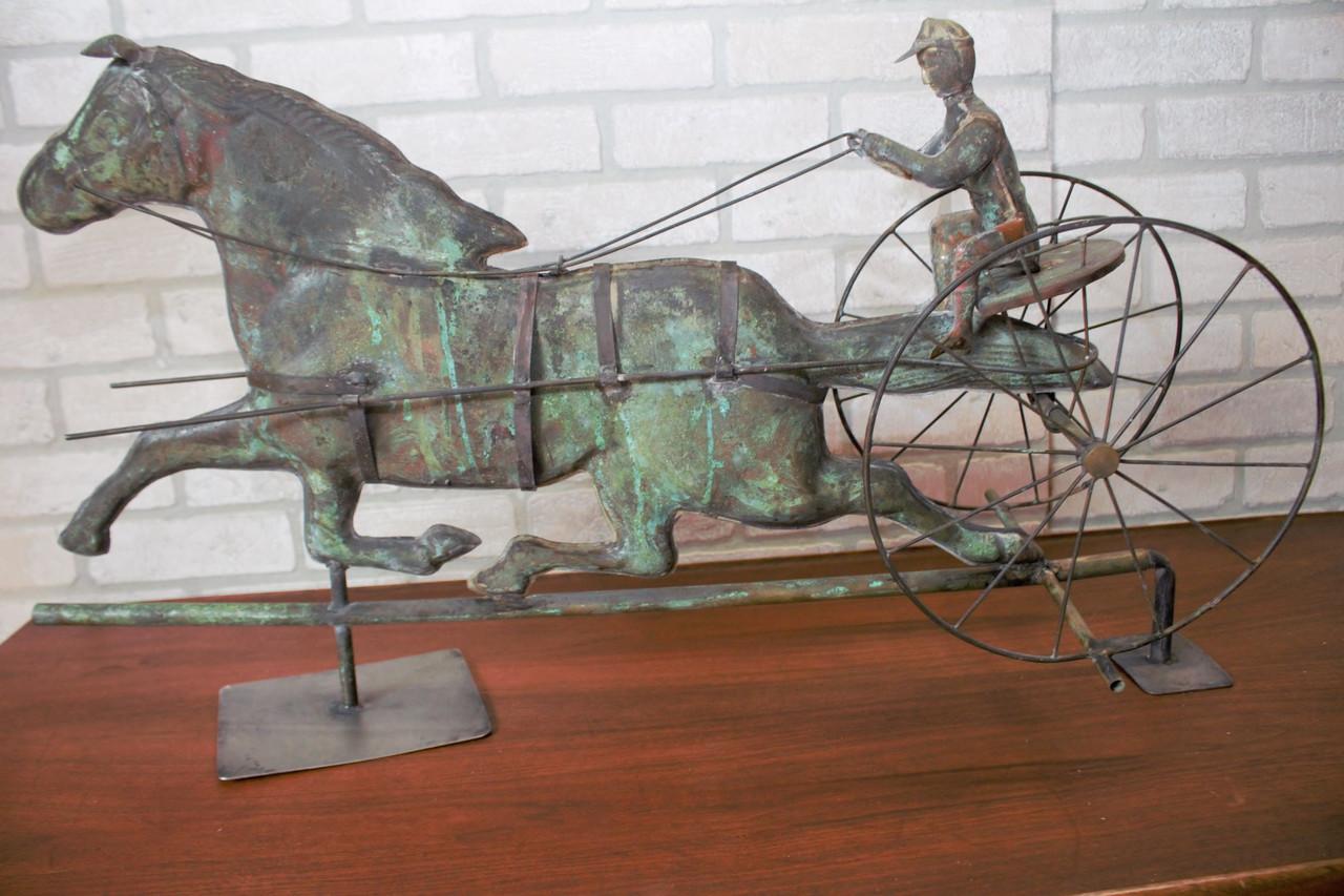 Antique American Copper Weathervane Sulky Jockey with Buggy Horse 

This trotting horse and seated jockey are handcrafted in copper with appropriate equipment needed for the sport. Accent your space with this unique piece of American folk
