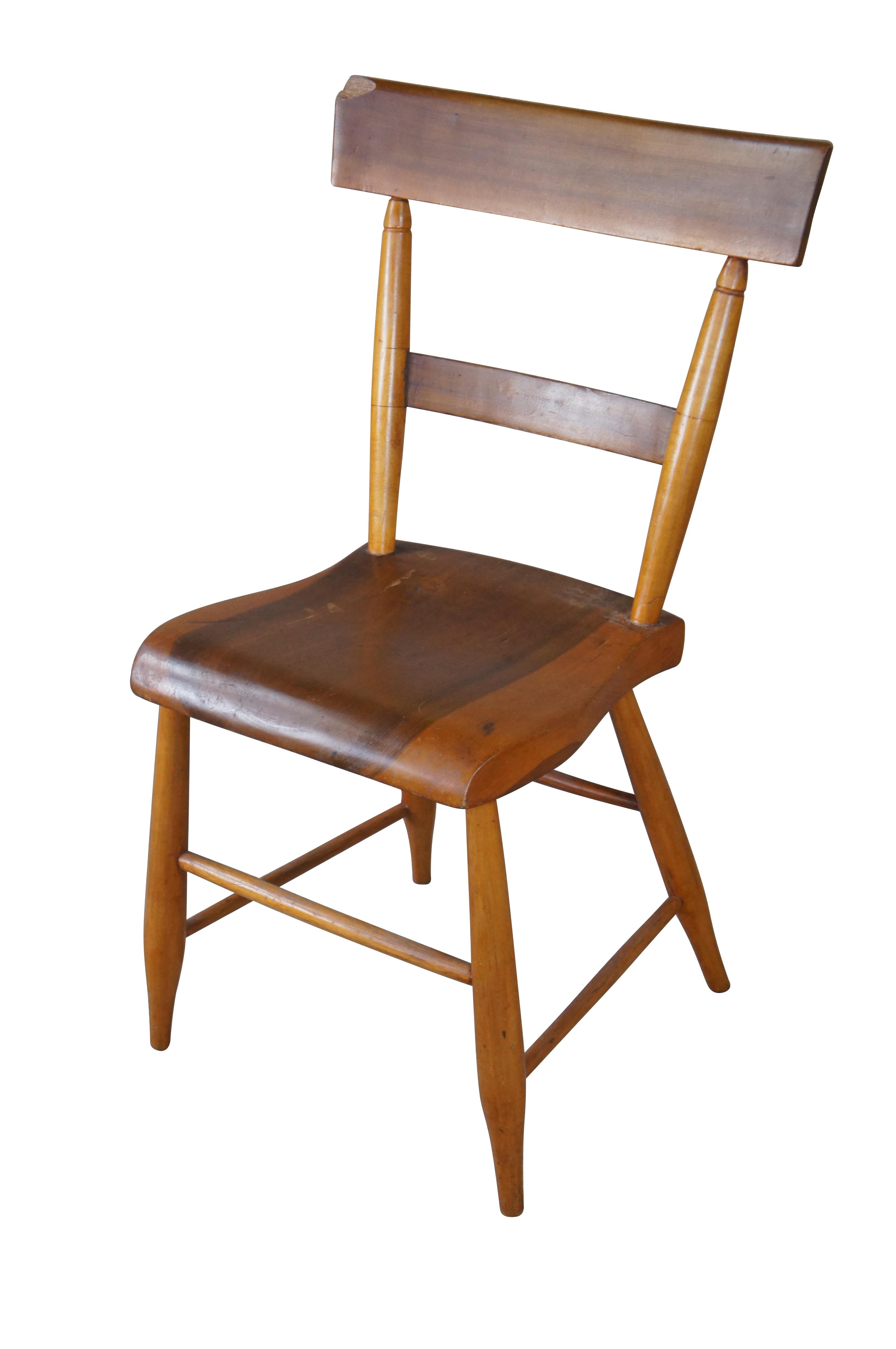 A charming antique side chair.  Features a petite size made from maple with a contoured plank seat.  A fun addition to any space.

Dimensions:
15