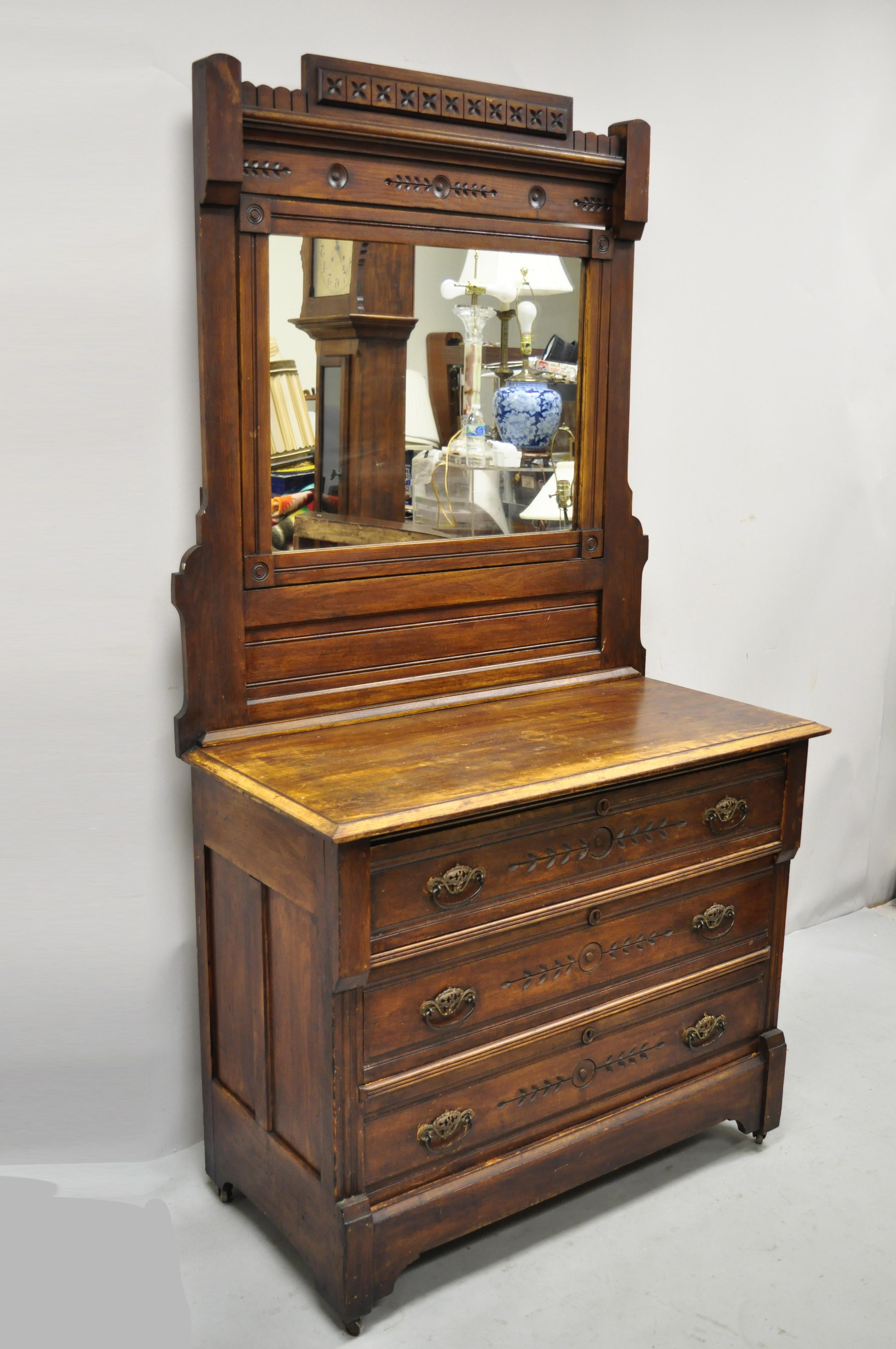 Antique American Eastlake Victorian walnut 3 drawer dresser and mirror. Item features tall mirror, solid wood construction, beautiful wood grain, distressed finish, no key, but unlocked, 3 drawers, brass hardware, very nice antique item, quality