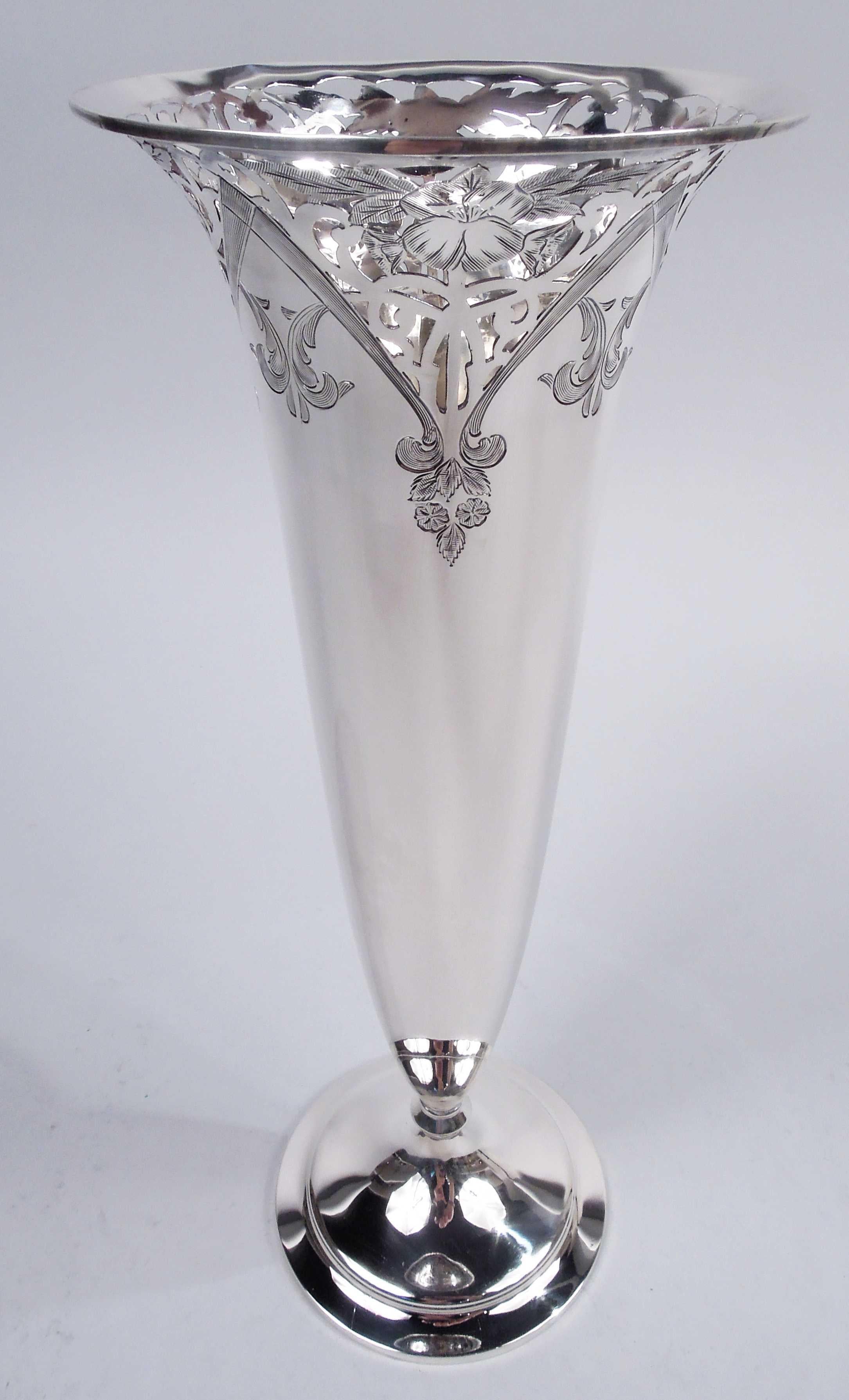 Edwardian Art Nouveau sterling silver vase. Made by Frank W. Smith in Gardner, Mass., ca 1910. Tapering sides with flared mouth, convex base knop, and raised and stepped foot. At top pierced scrollwork and engraved flowers and leaves framed by