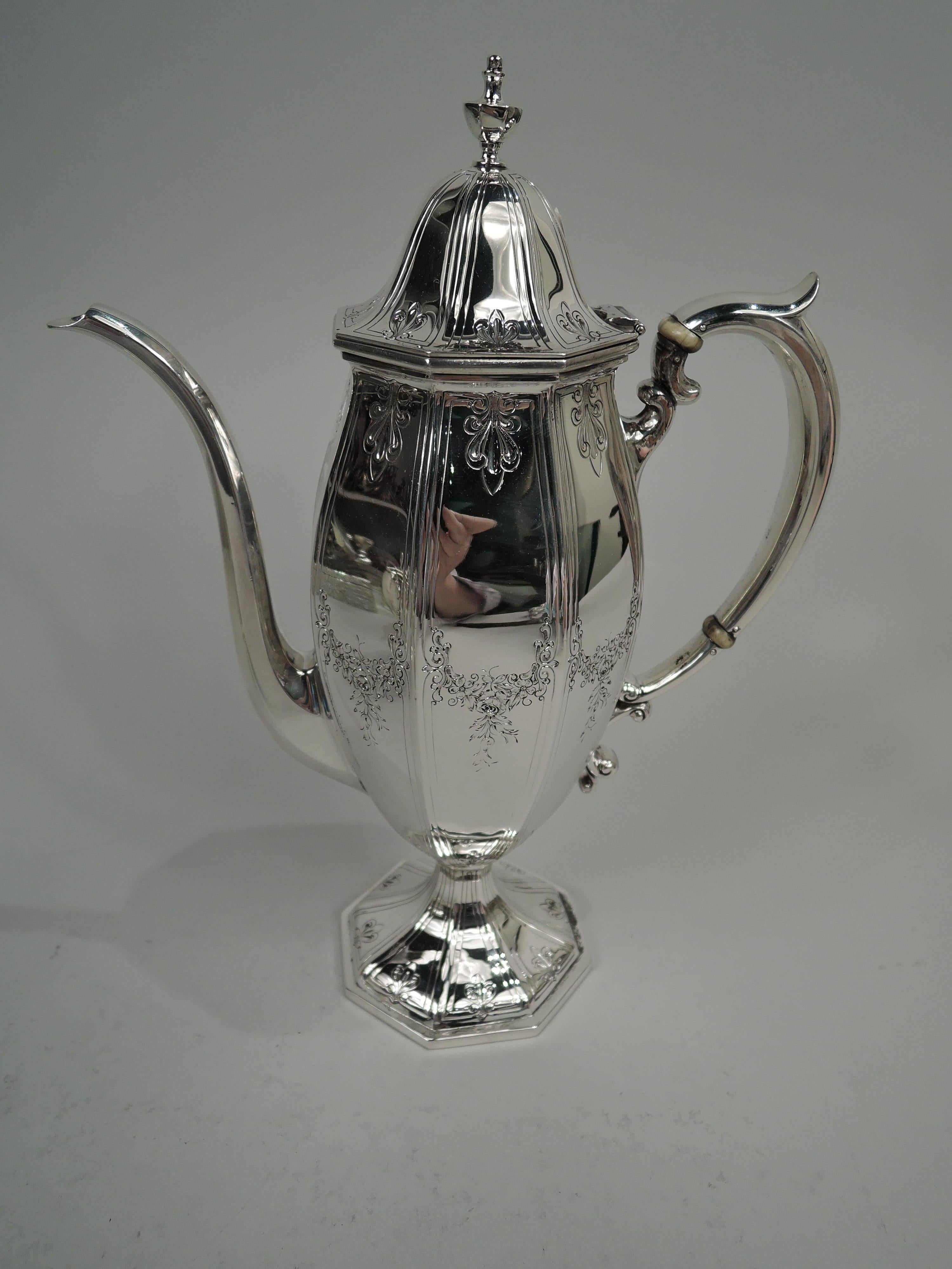 Edwardian Regency sterling silver 3-piece coffee set, ca 1910. This set comprise coffeepot, creamer, and sugar. Coffeepot and creamer have ovoid body. Sugar has round body. All faceted with raised foot and capped double-scroll handles. Coffeepot