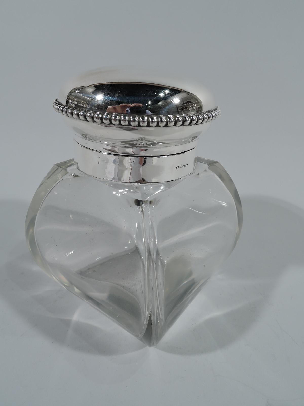 American Edwardian sterling silver and clear glass candy jar. Four-sided and bombe bowl with star cut to underside. Short neck in sterling silver collar and hinged and beaded cover (also sterling silver). Hallmarked Goodnow & Jenks, who were active