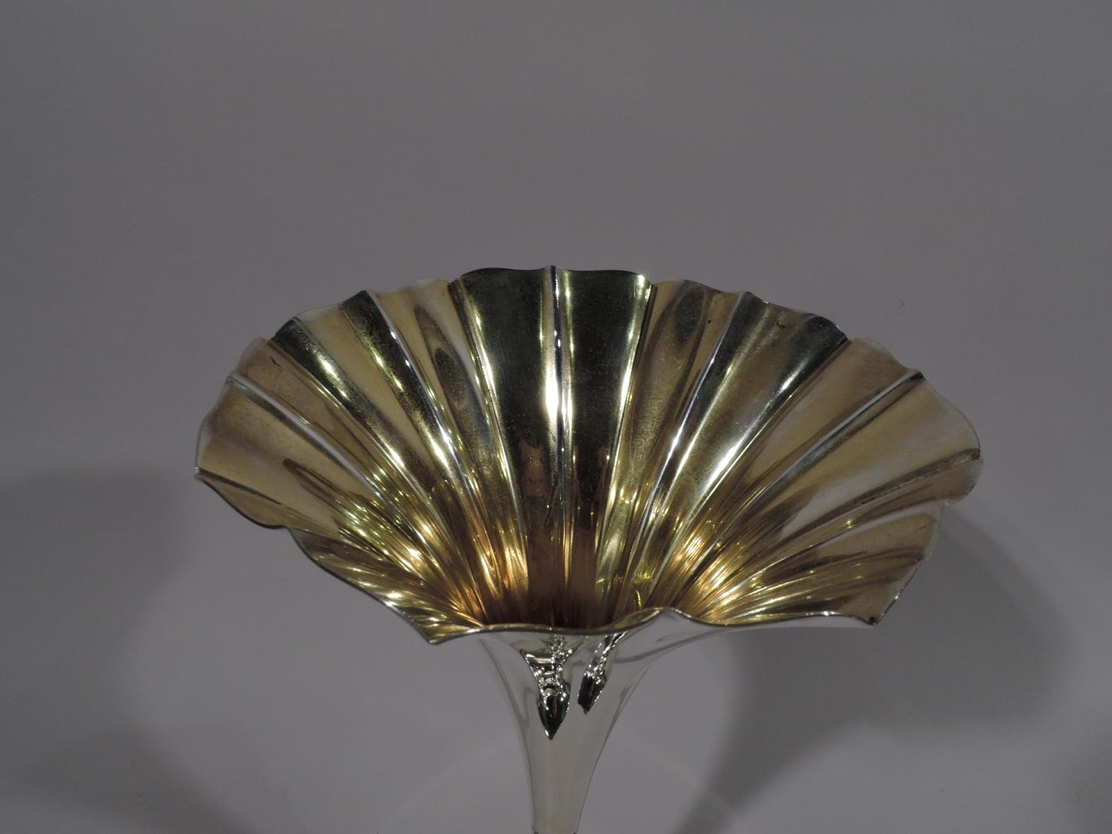 Edwardian sterling silver vase. Made by Tiffany & Co. in New York, ca 1910. Elongated cone on small dome set in flat circular foot. Flutes and applied beads. Gilt interior. Fully marked including pattern no. 11908F and director’s letter m. Weight: 8