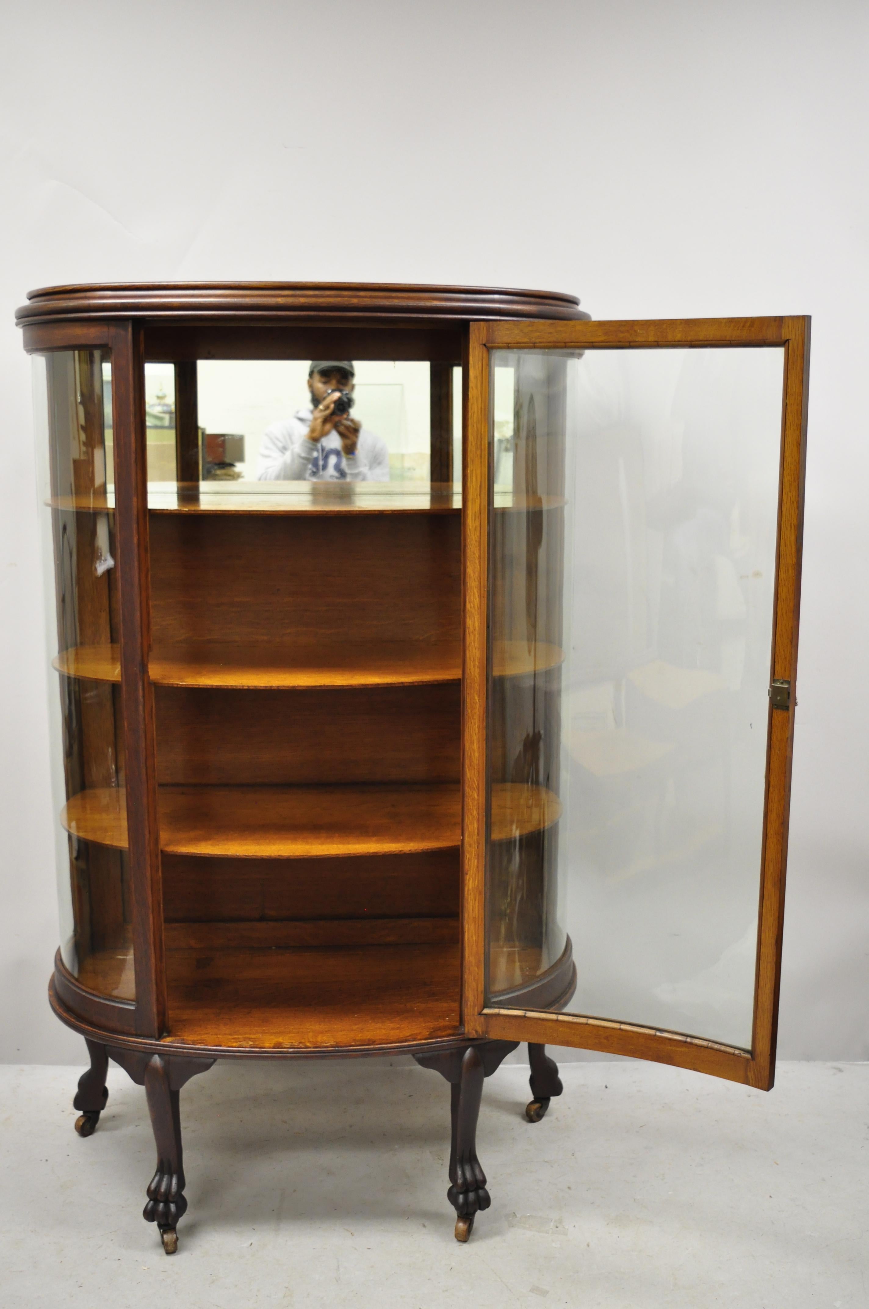 Antique American Empire Bow Glass Oak Paw Feet Mirror Back China Cabinet Curio In Good Condition In Philadelphia, PA
