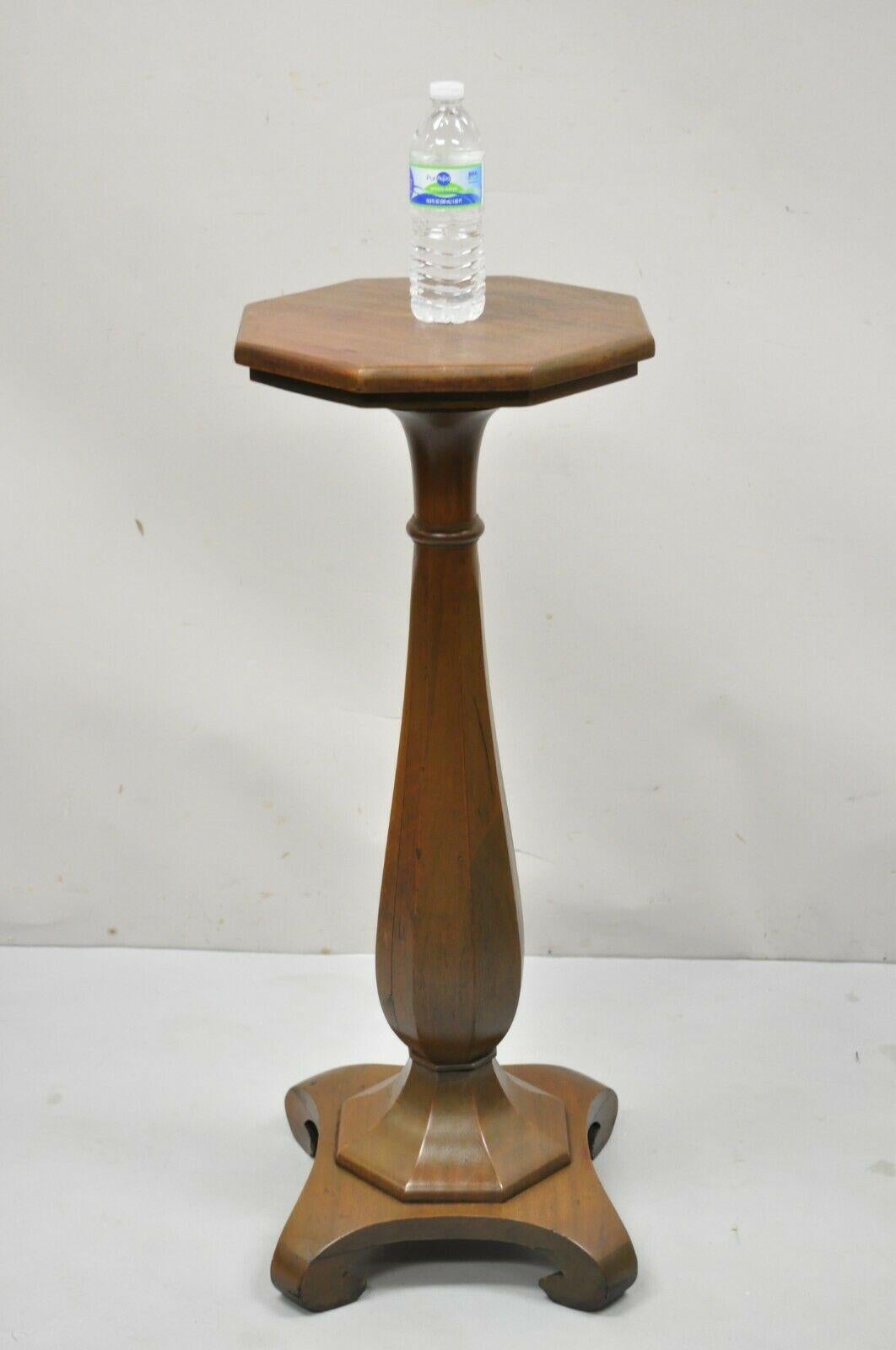 Antique American Empire Carved Mahogany Octagonal Top Pedestal Column Plant Stand. Item features an octagonal top, shapely carved central column, solid wood construction, beautiful wood grain, nicely carved details, very nice antique item, quality