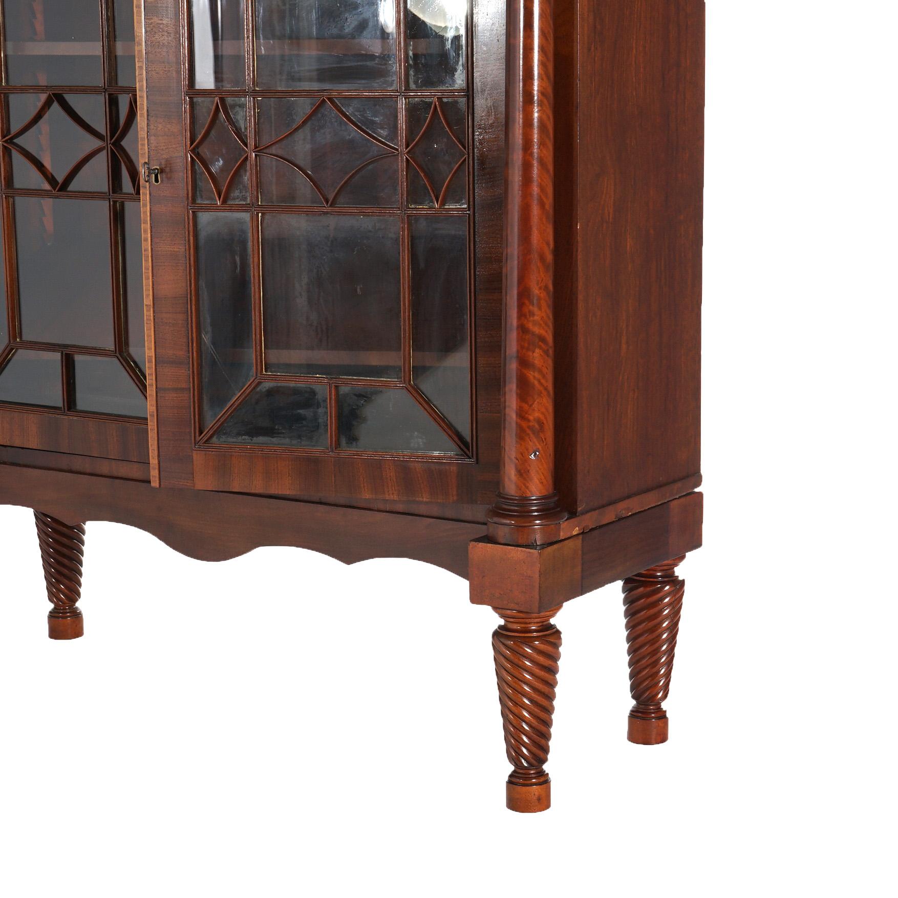 ***Inquire About Reduced In-House Delivery Rates - Reliable Professional Service & Fully Insured***

Antique American Empire Classical Greco Flame Mahogany Double Door Bookcase with Full Flanking Columns and Rope Twist Legs C1840

Measures - 58 1/4