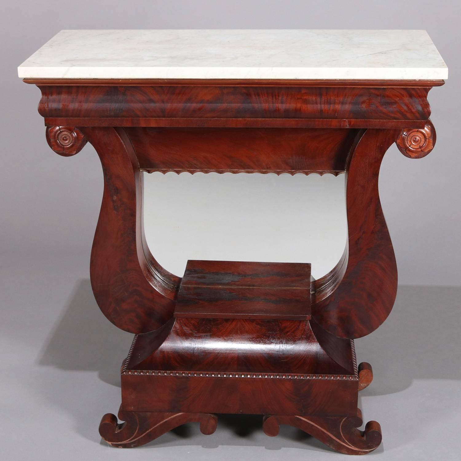 Antique American Empire marble-top pier table features flame mahogany construction in lyre form with rosettes on scroll ends and seated on scroll form feet with scalloped skirting, lower display and mirrored back, circa 1830

Measures - 37.5
