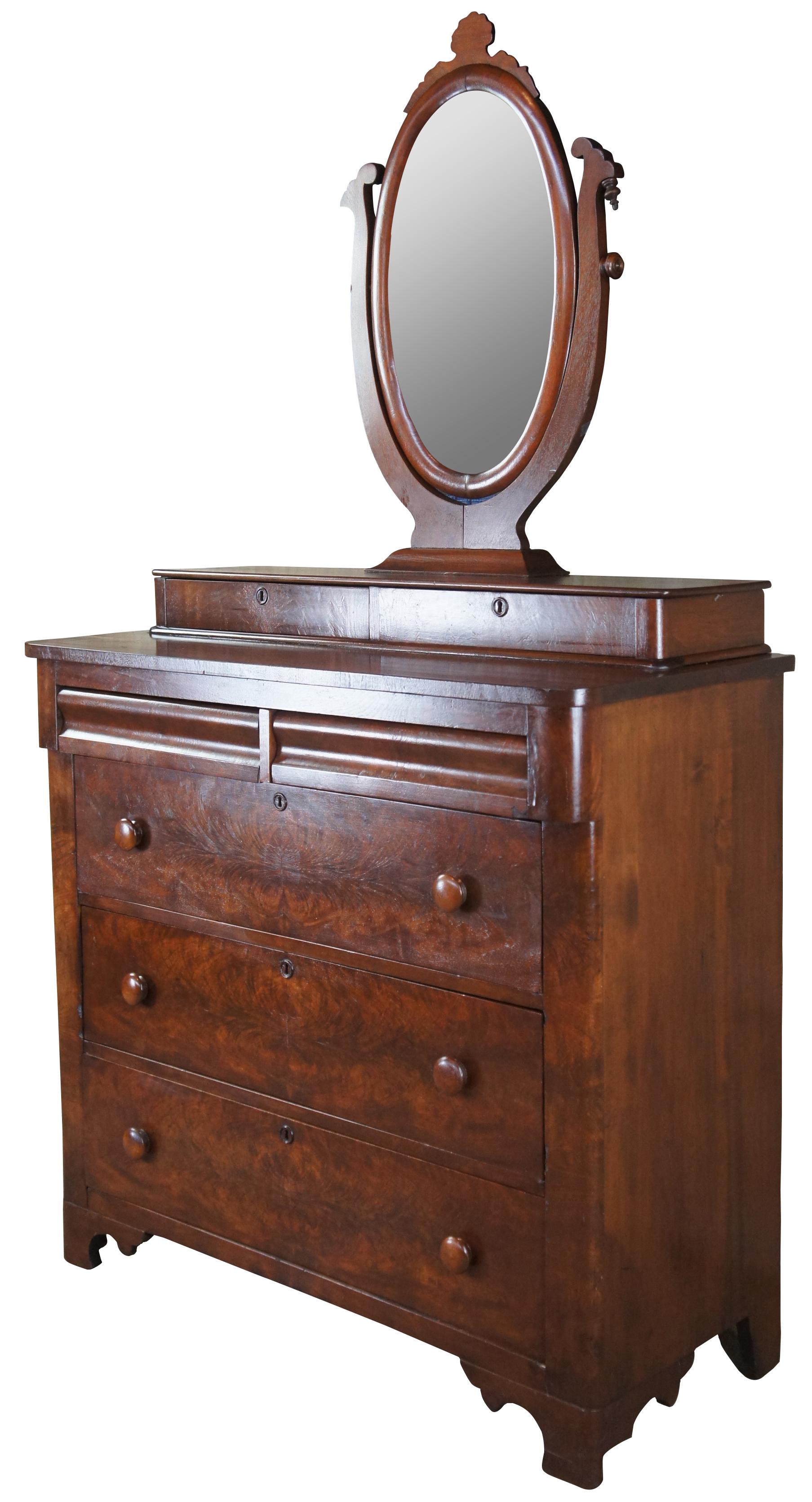 Antique American Empire mirror top dresser, circa 1860s Made from walnut featuring matchbook (burled) drawer fronts, a wishbone mirror, three full sized drawers, two upper drawers and two stepback glove box drawers.

Measures: 43.25