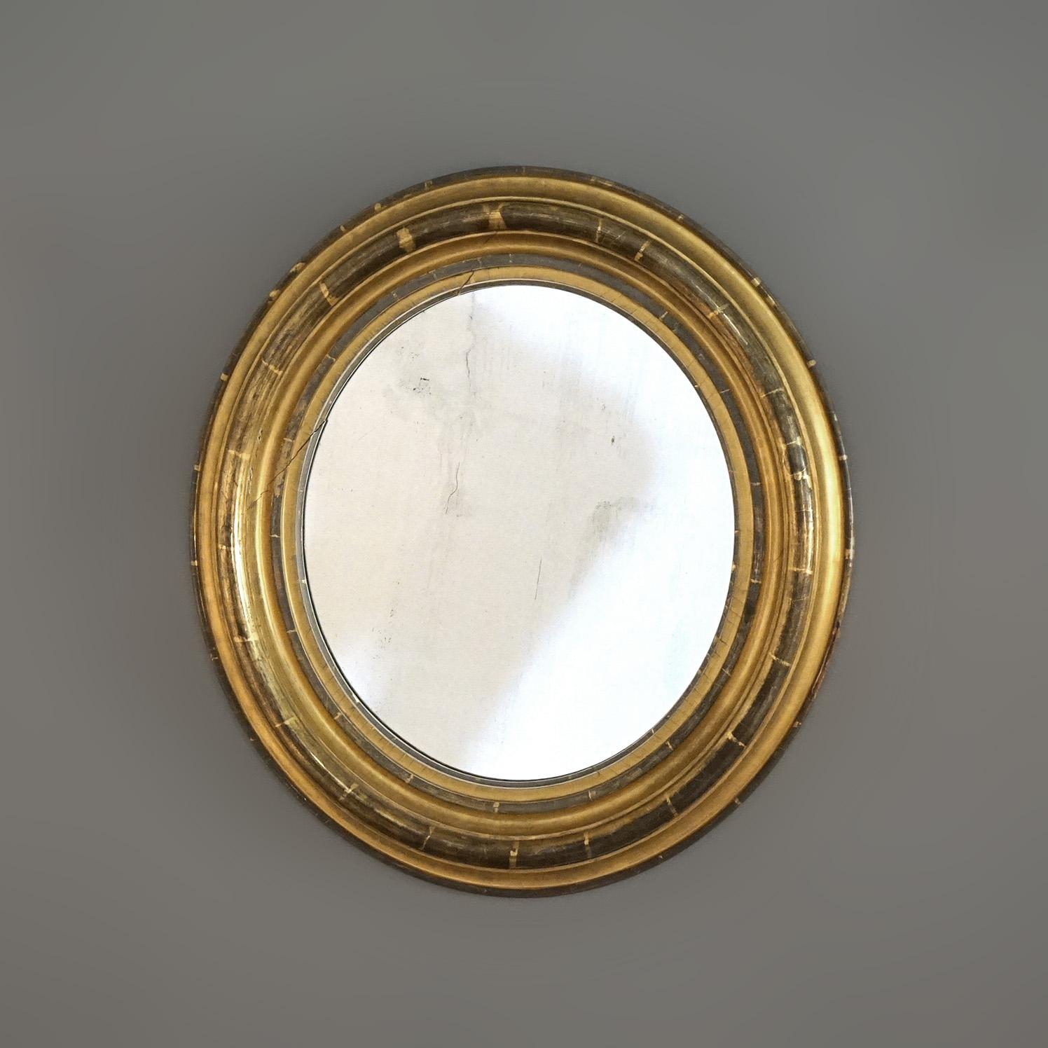 An antique American Empire oval wall mirror offers first finish giltwood frame, c1840

Measures- 23''H x 21''W x 3''D overall ; 14'' x 16'' sight 