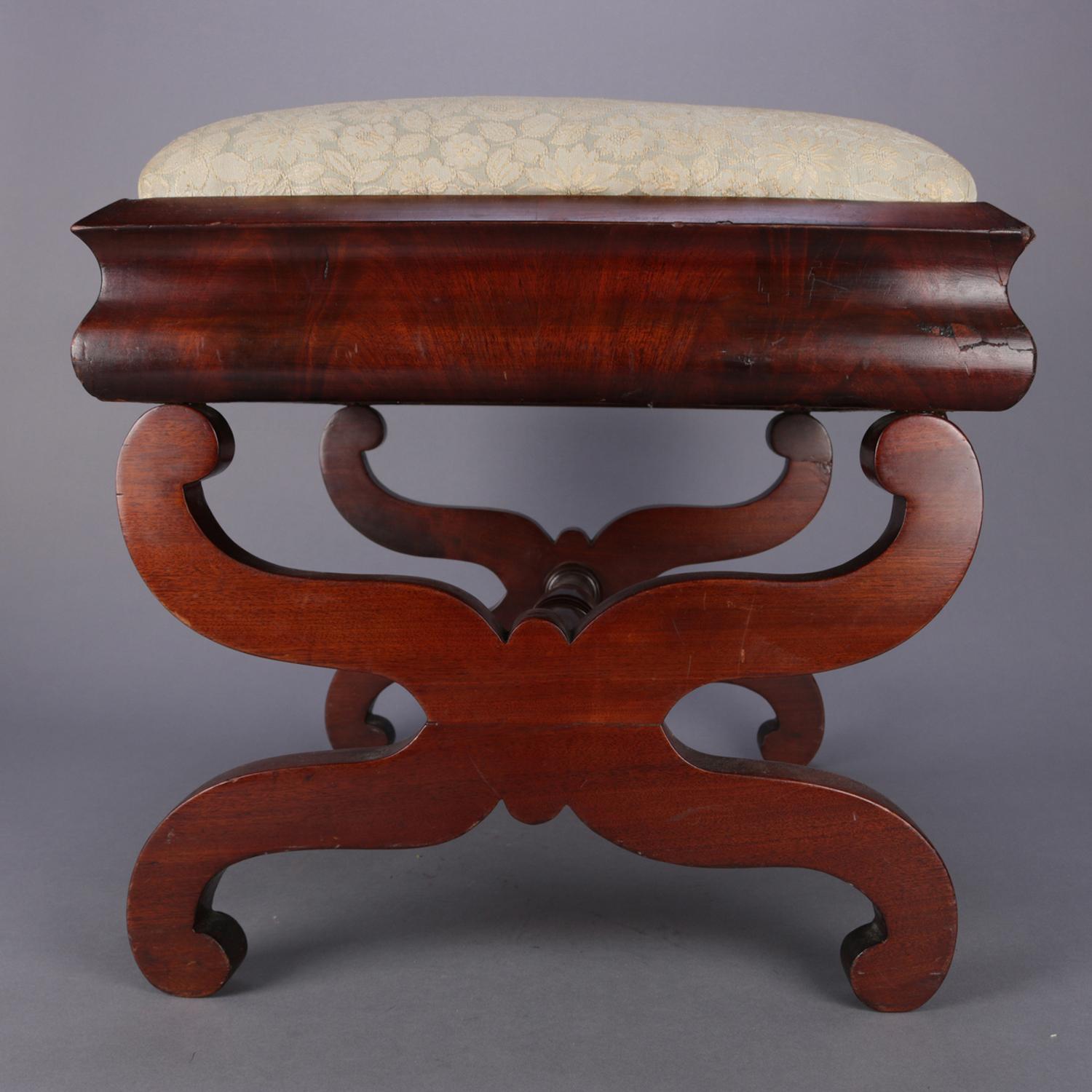 cushioned footstool associated with empire