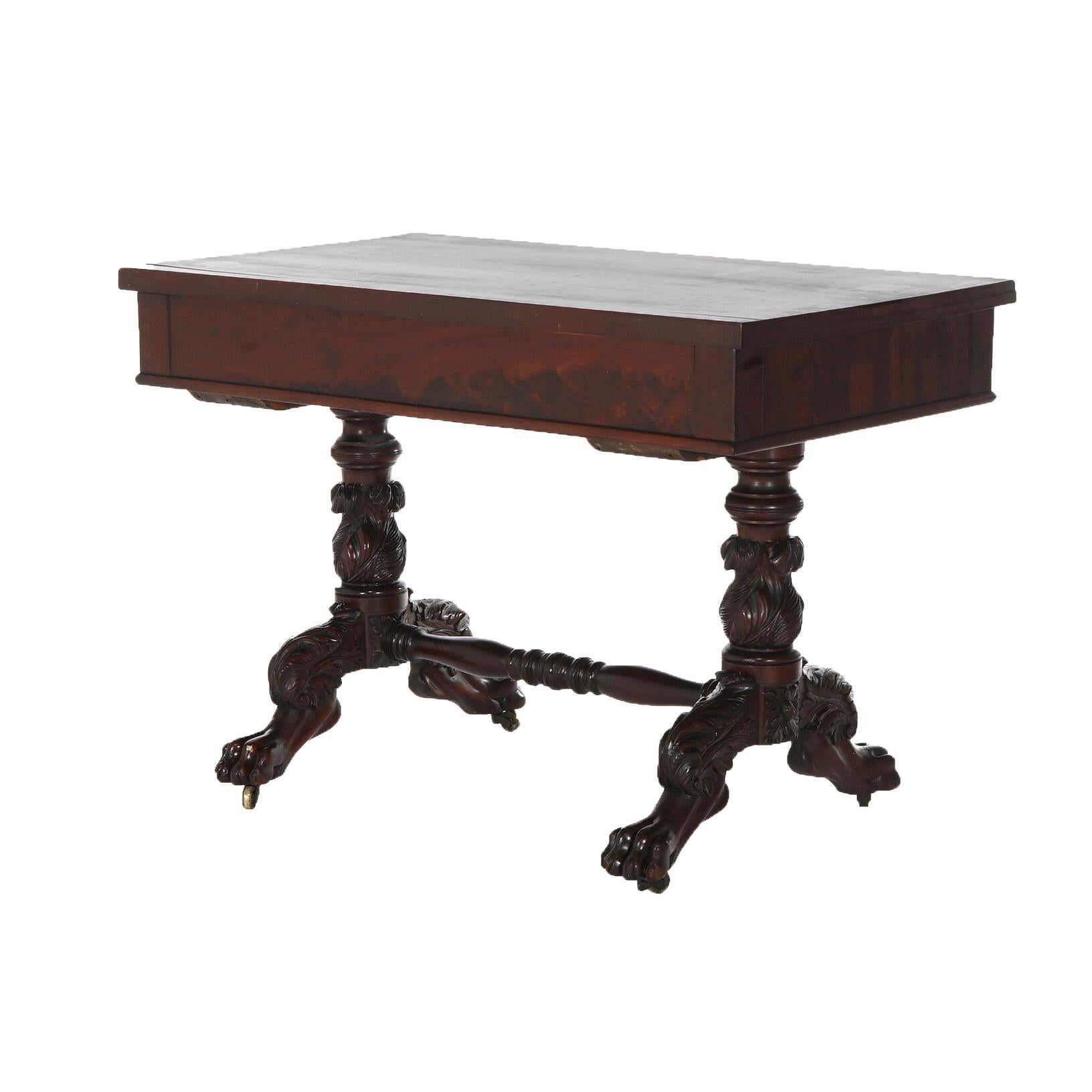 ***Ask About Reduced In-House Delivery Rates - Reliable Professional Service & Fully Insured***

An antique American Empire sofa table offers flame mahogany construction with rectangular top having deep skirt and raised on balustrade legs with